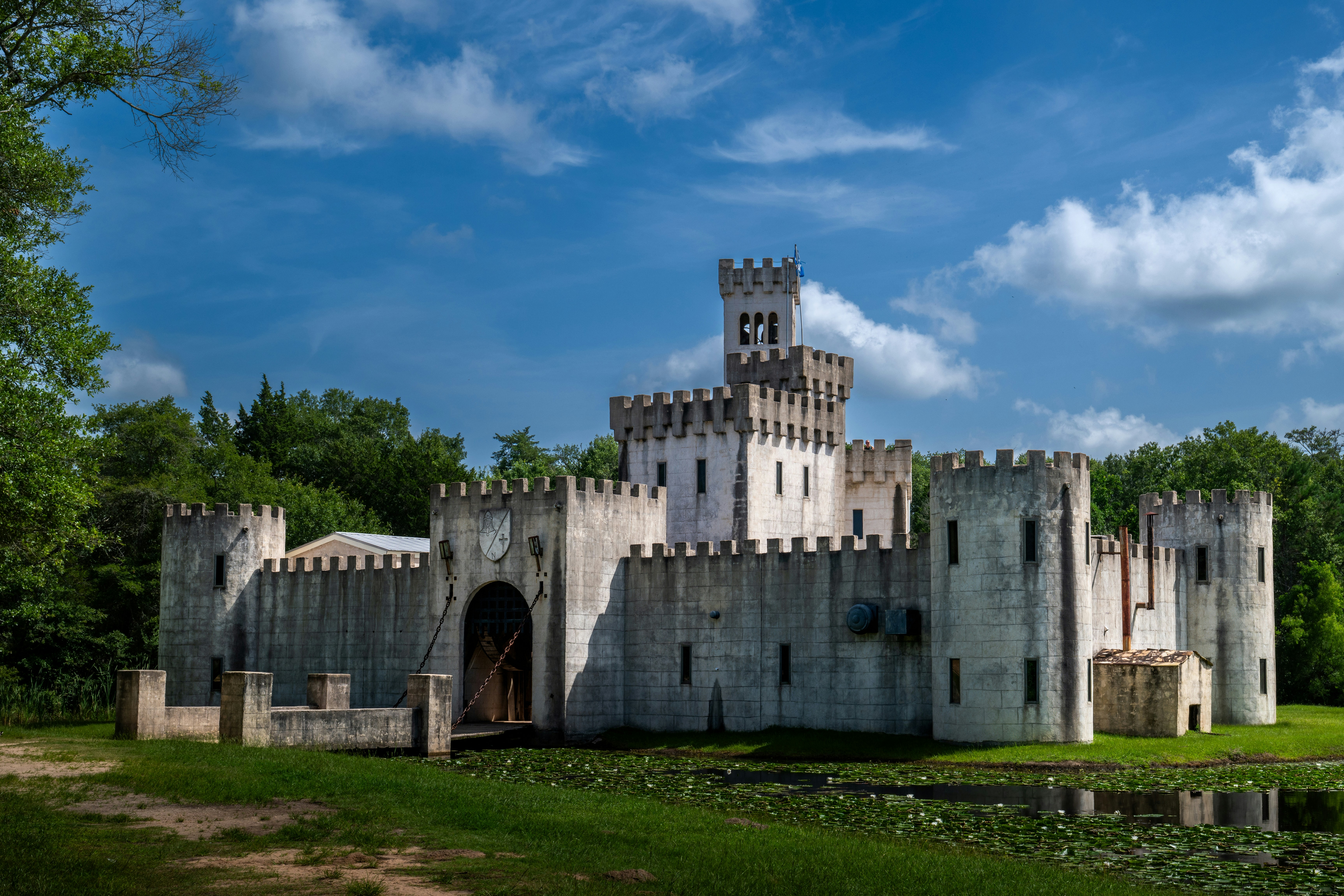 A white castle stands against a blue sky.