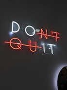 The neon sign says "don't quit."