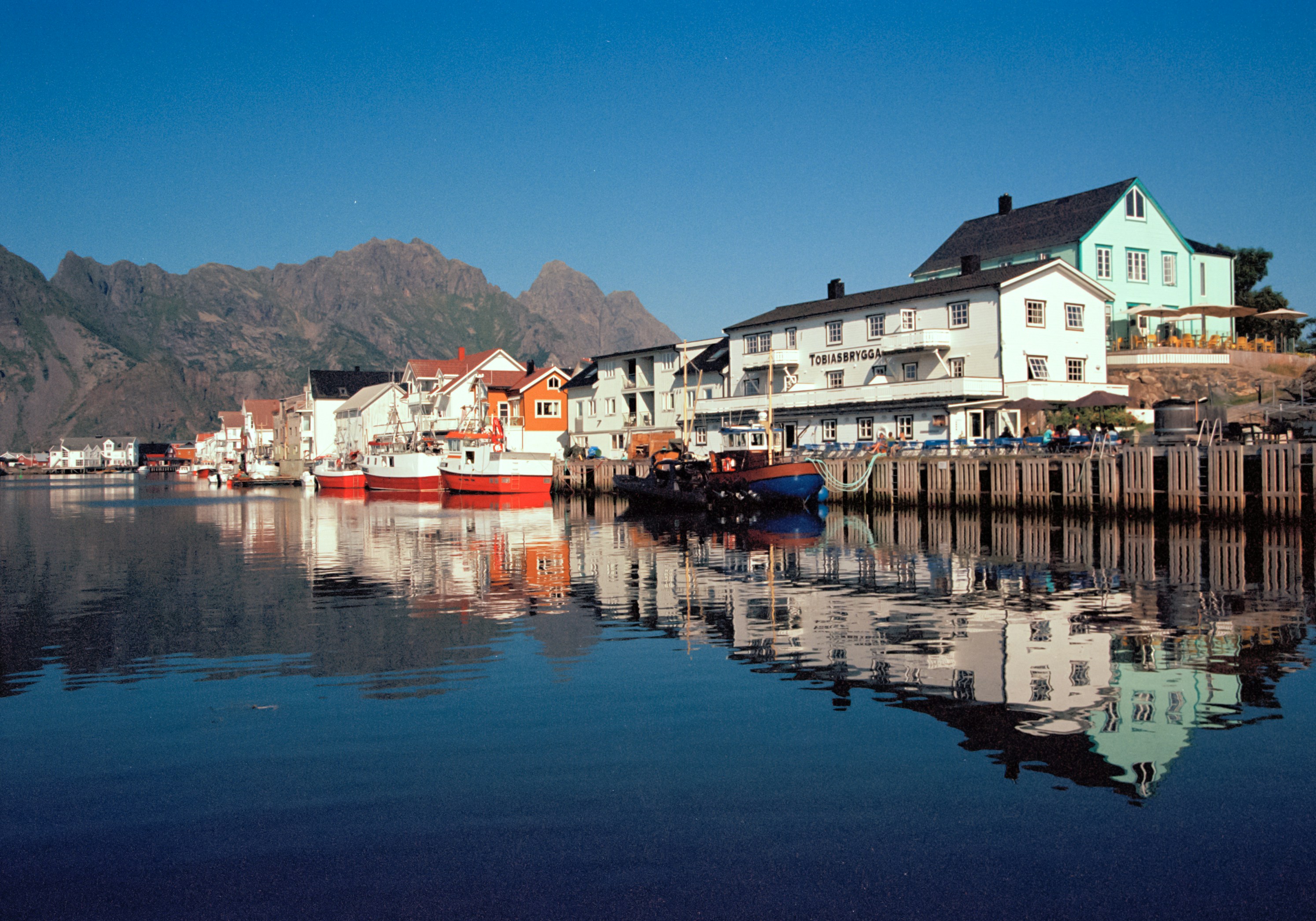 Coastal town reflects beautifully on the water.