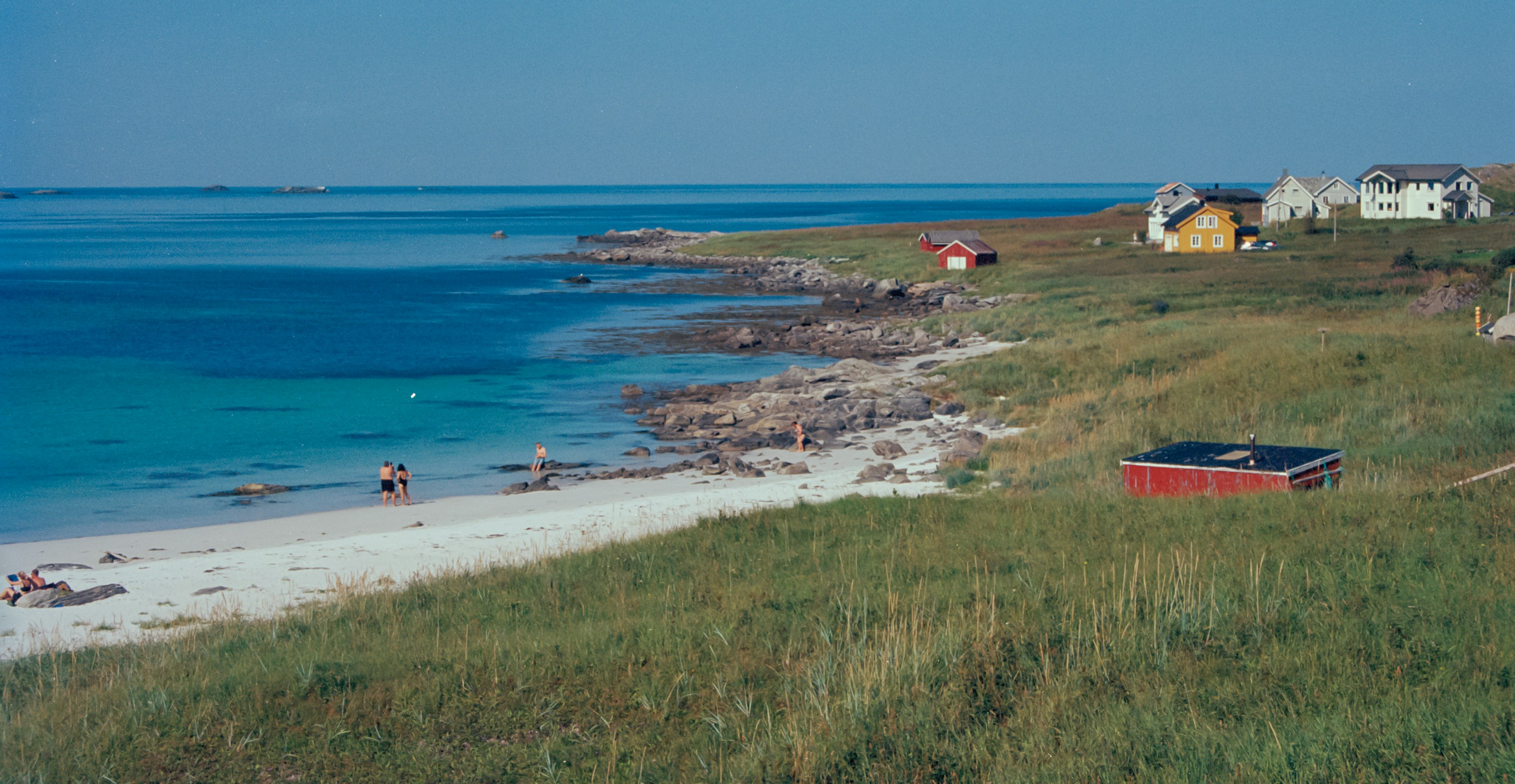 A picturesque beach scene with clear waters.