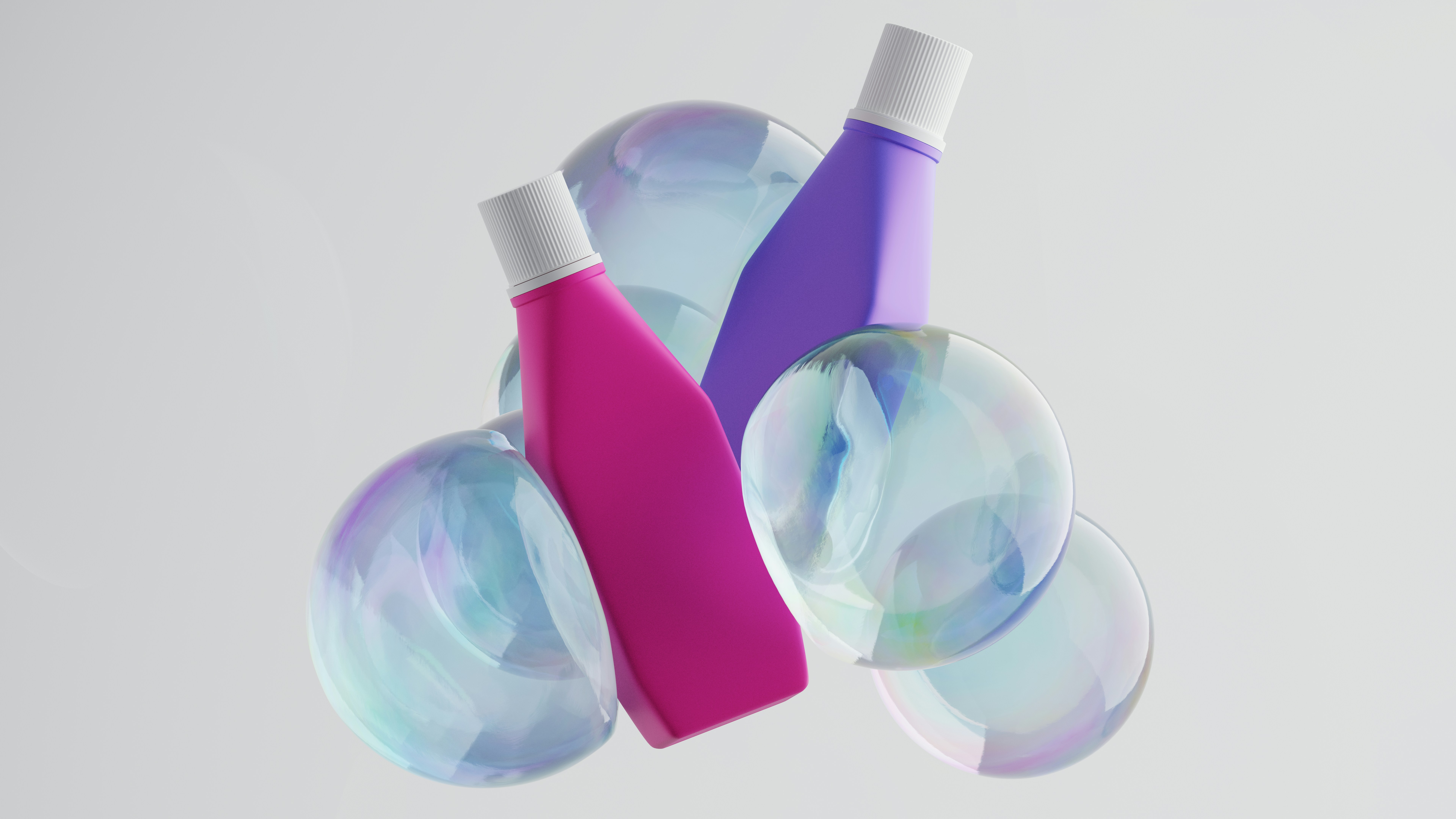 Bottles and bubbles floating against a white backdrop