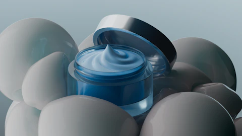 Cosmetic cream jar surrounded by spheres.
