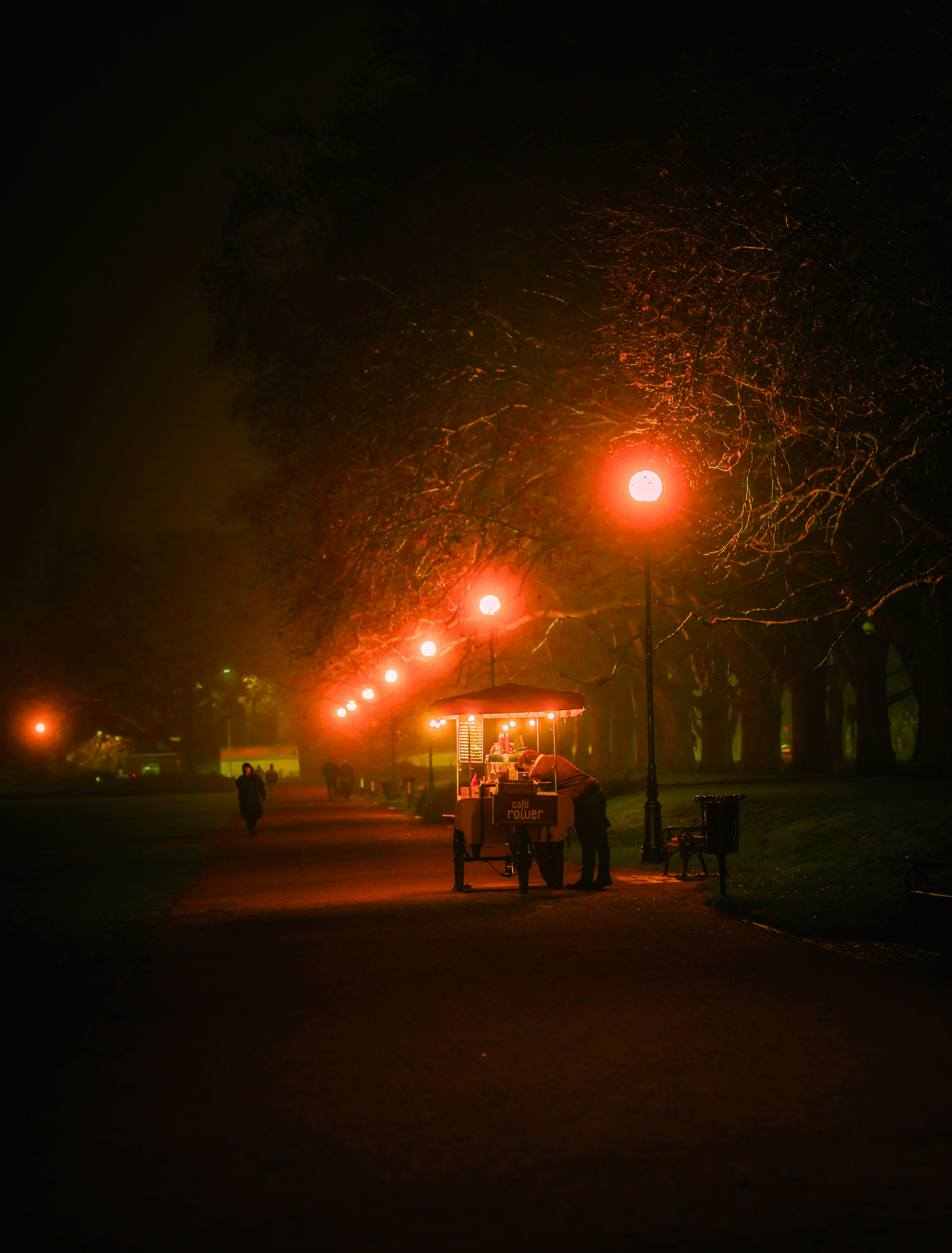A cart sits illuminated beneath glowing lights.