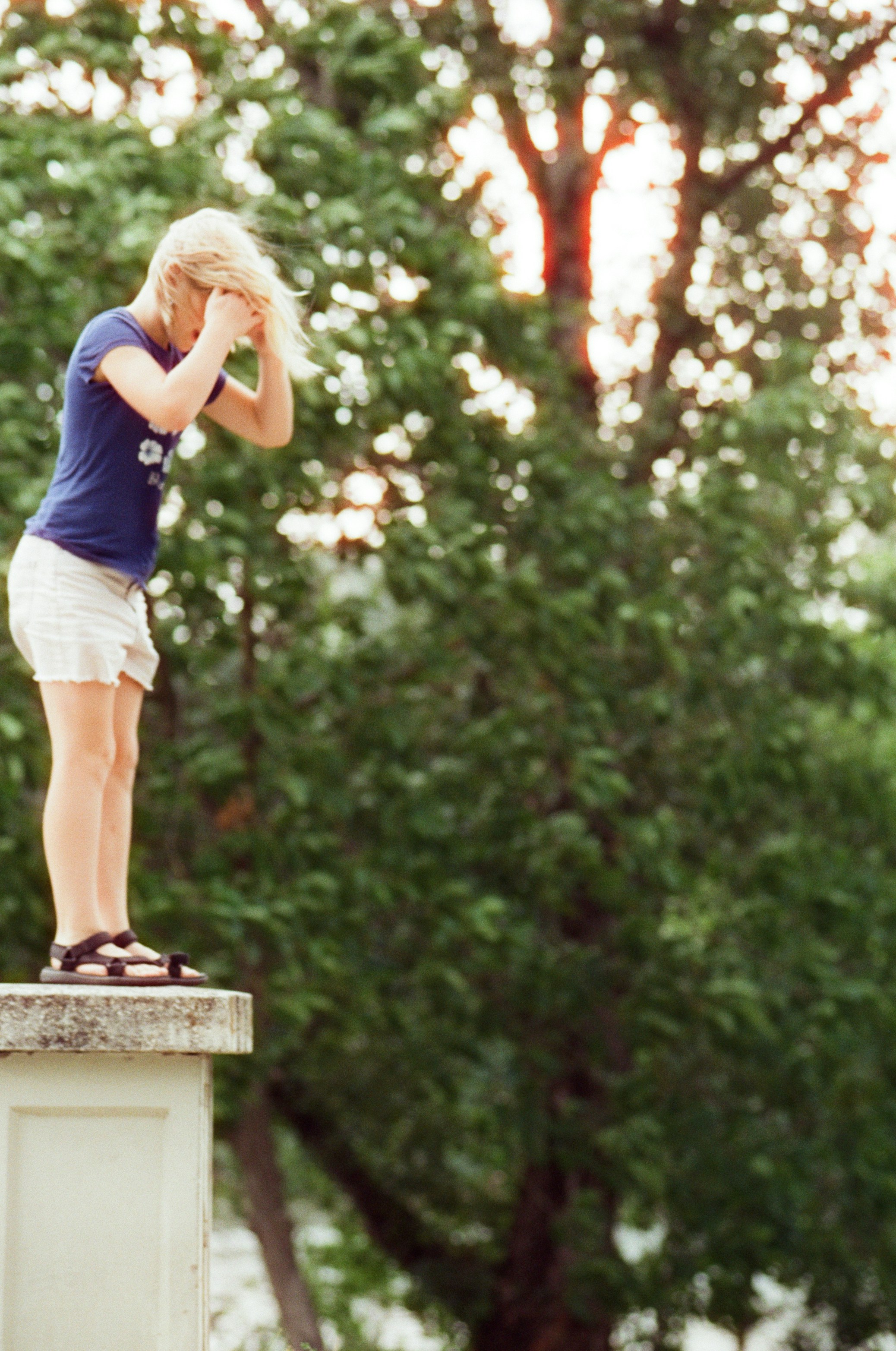 A girl stands on the edge, ready to jump