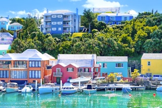 Colorful buildings and boats line the waterfront.