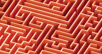 A complex, orange maze is pictured.