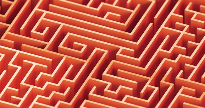 A complex, orange maze is pictured.