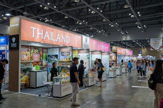 A trade show booth displays products from thailand.