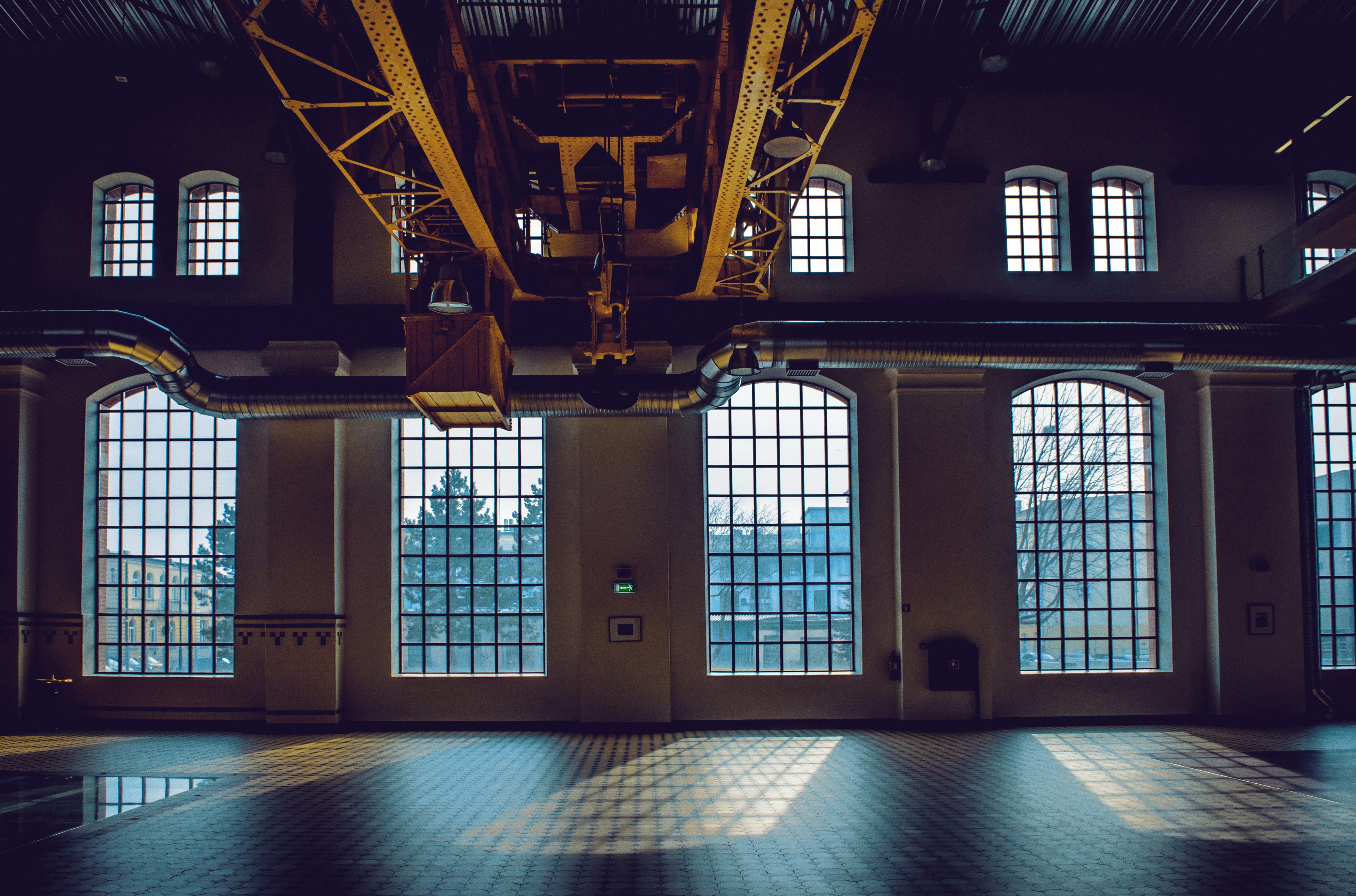 Large industrial interior with multiple windows.