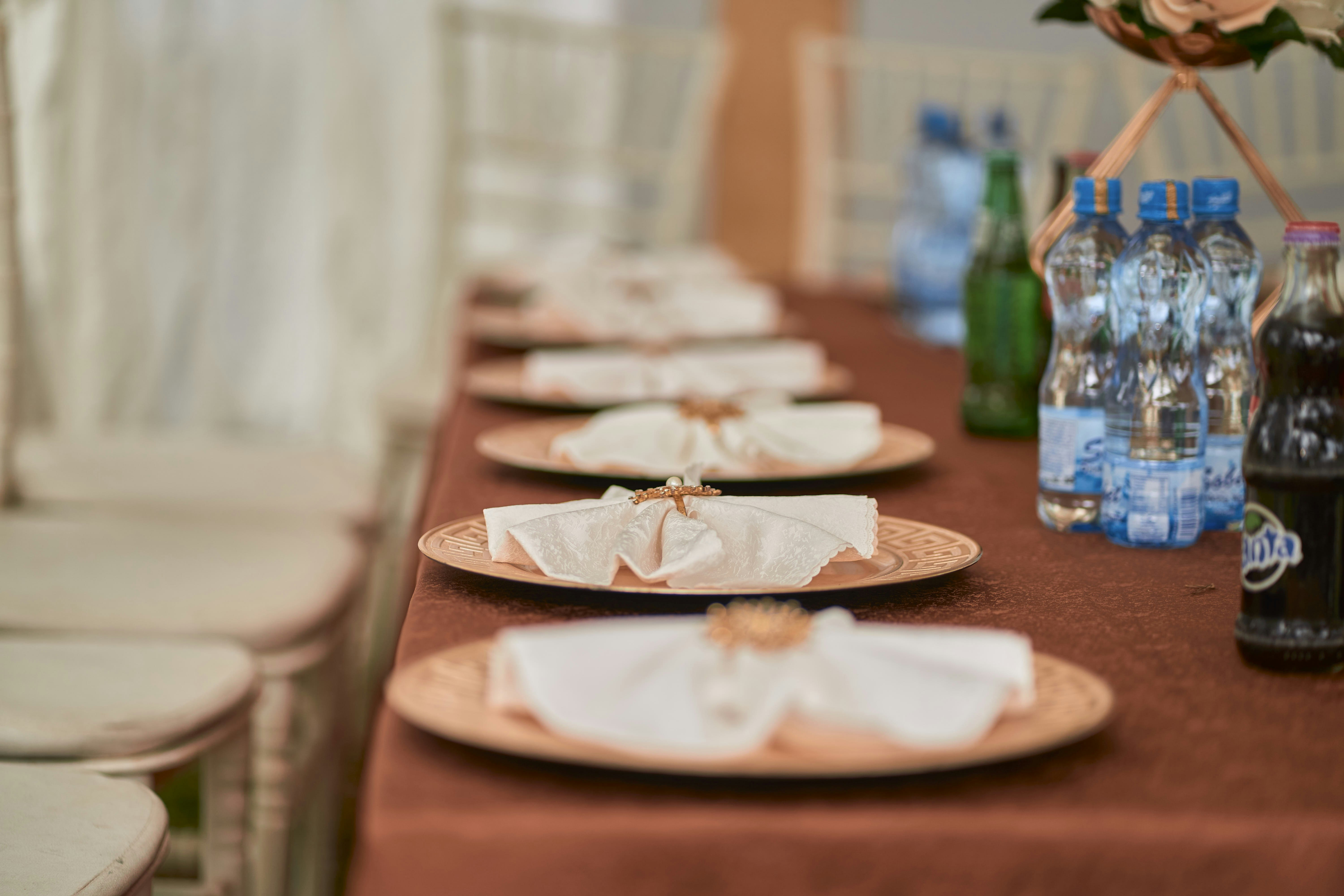 A table is set with plates and napkins.
