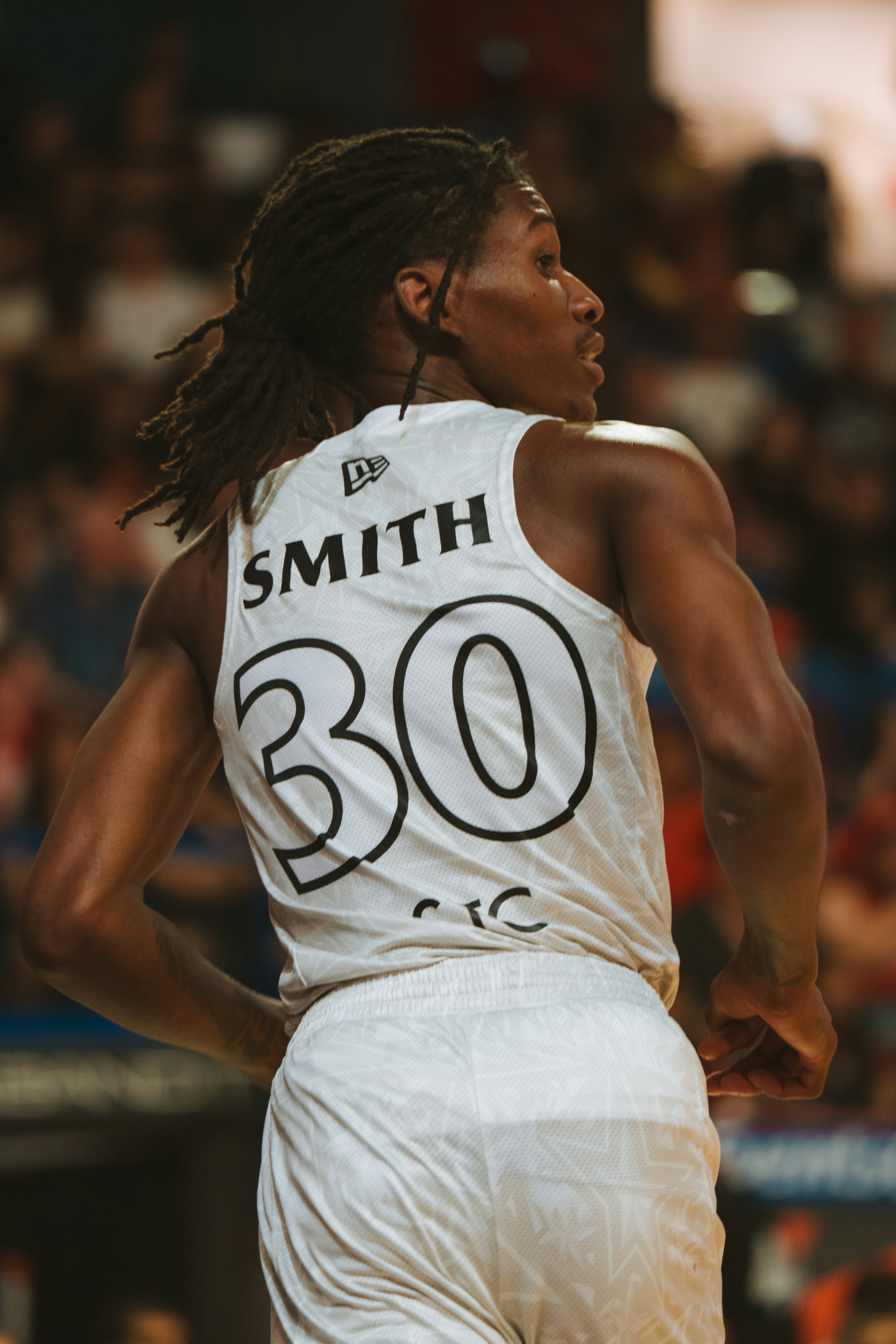 Basketball player smith wearing jersey number 30.