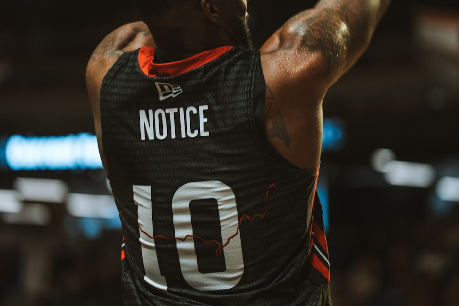 A basketball player with "notice" on his jersey.