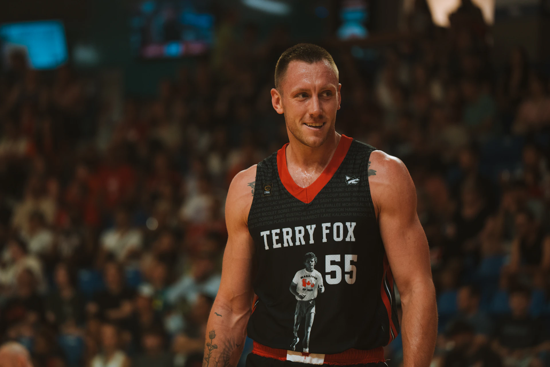 A basketball player wears a jersey that says 
