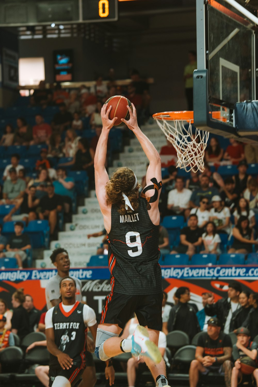Player shooting toward the hoop