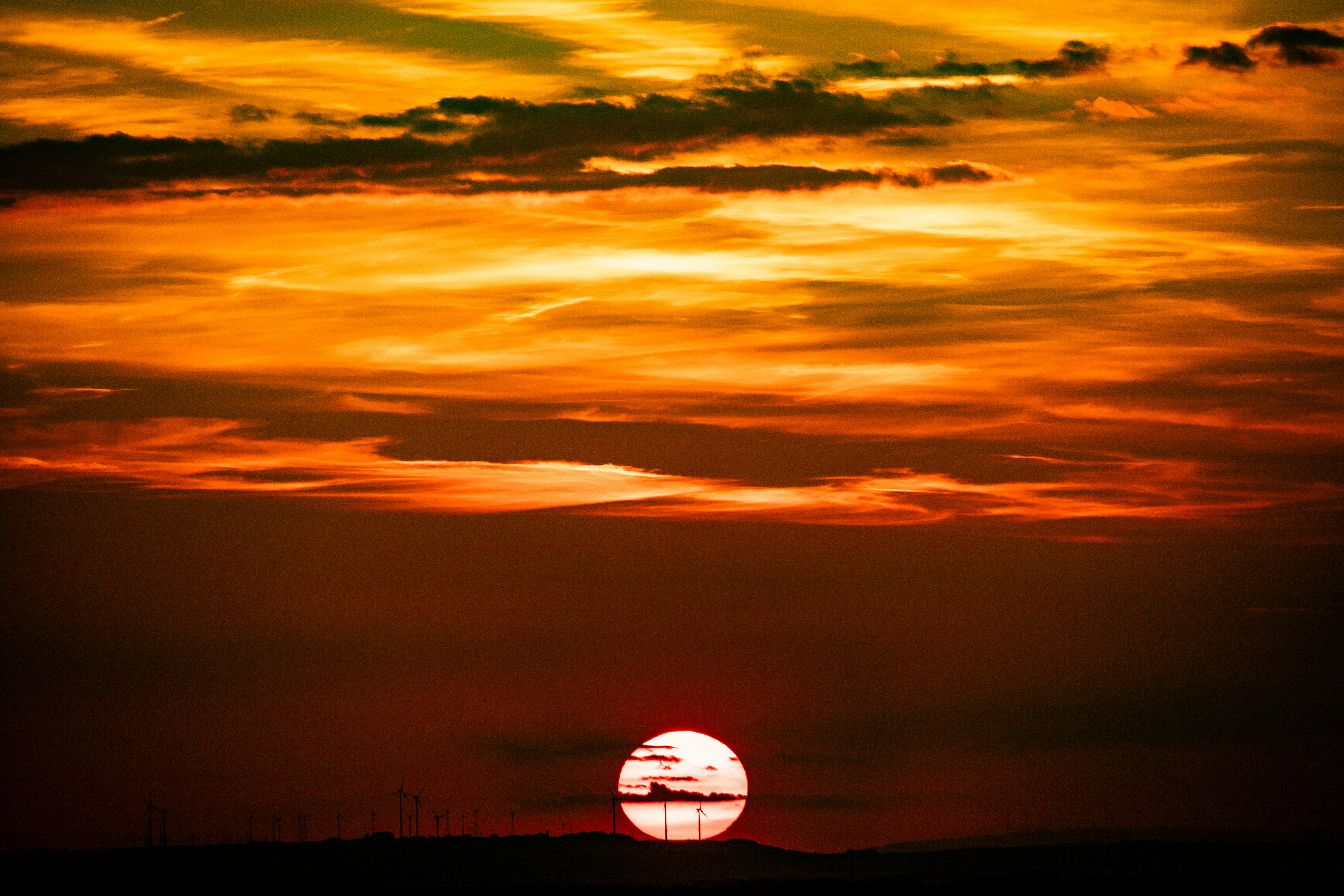 Sunset paints the sky with fiery hues.