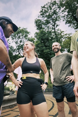 Group of people are smiling and ready to run.