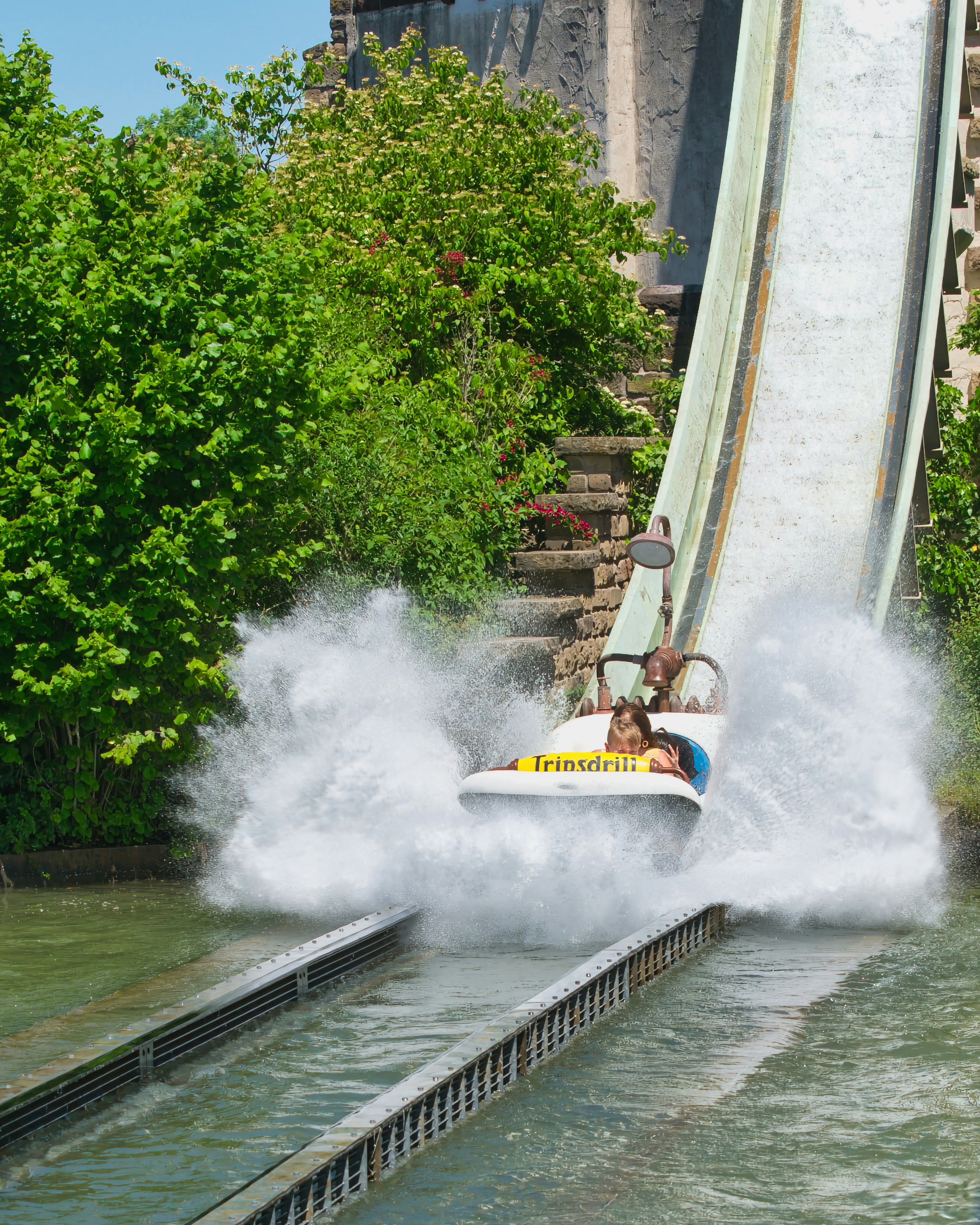 People enjoy a water ride with a big splash!