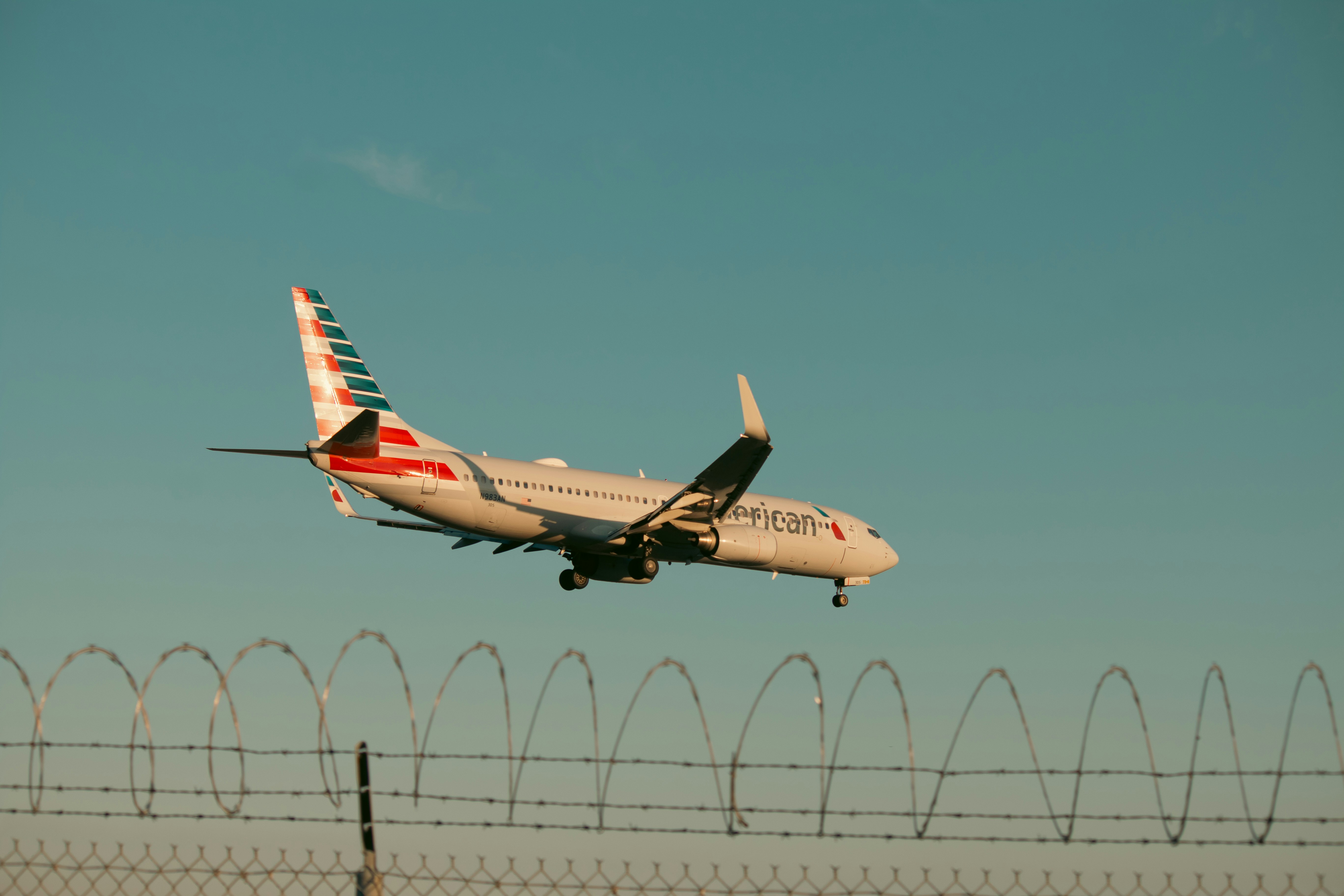 An american airlines plane is landing.