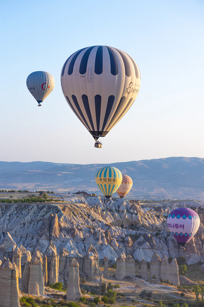 Rocky valleys of Cappadocia beneath balloons