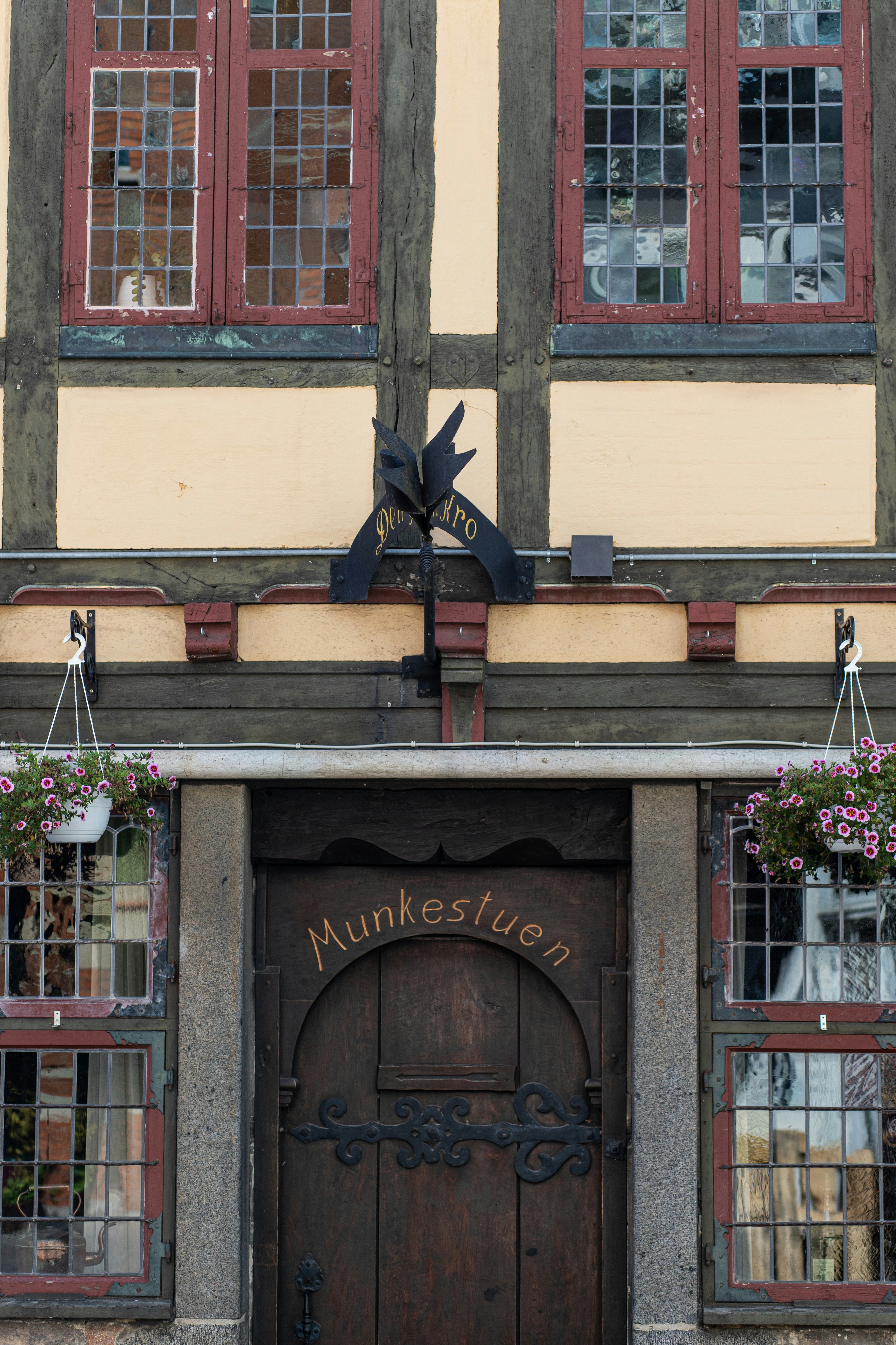 A historic building entrance with decorative windows.