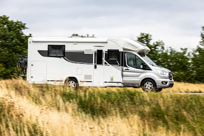 A motorhome drives along a roadway