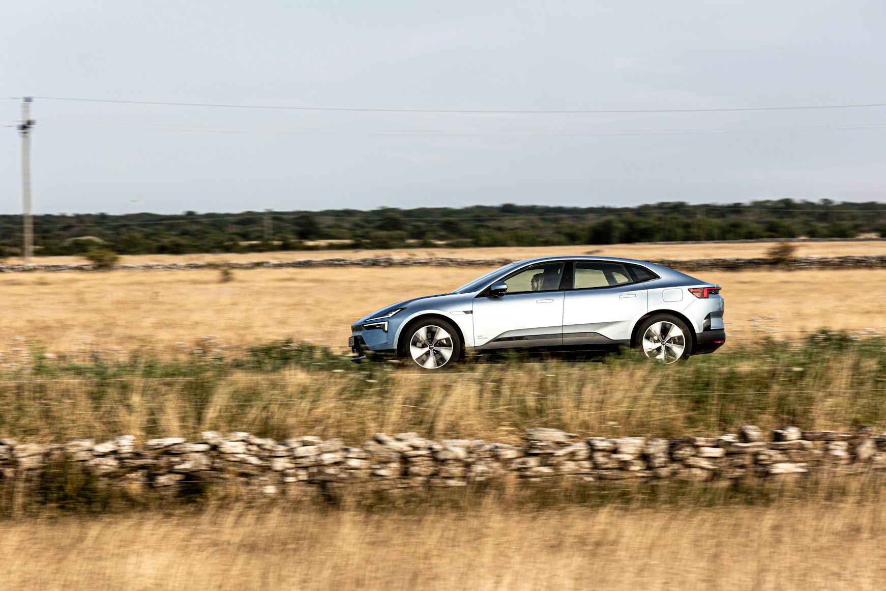 Electric vehicle on a scenic highway road trip