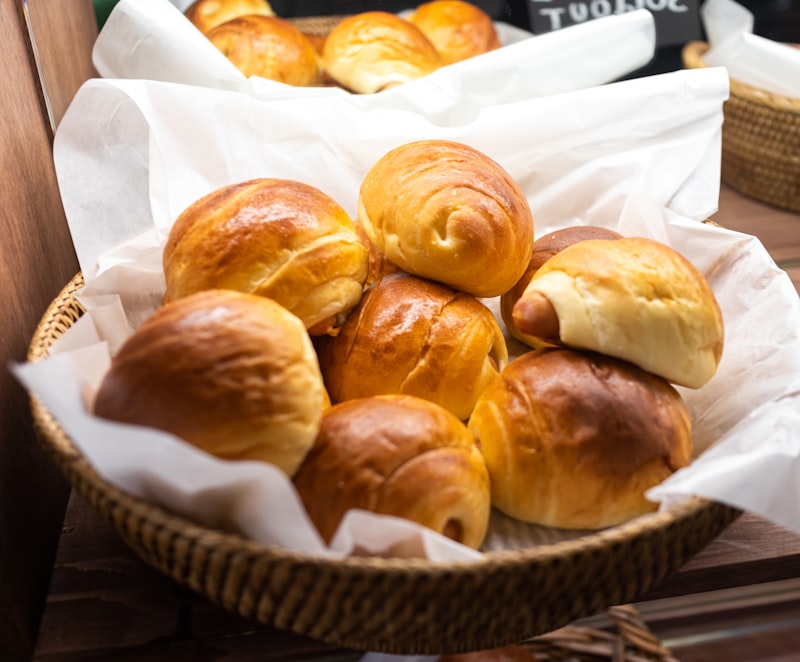 Freshly baked bread rolls piled in a basket