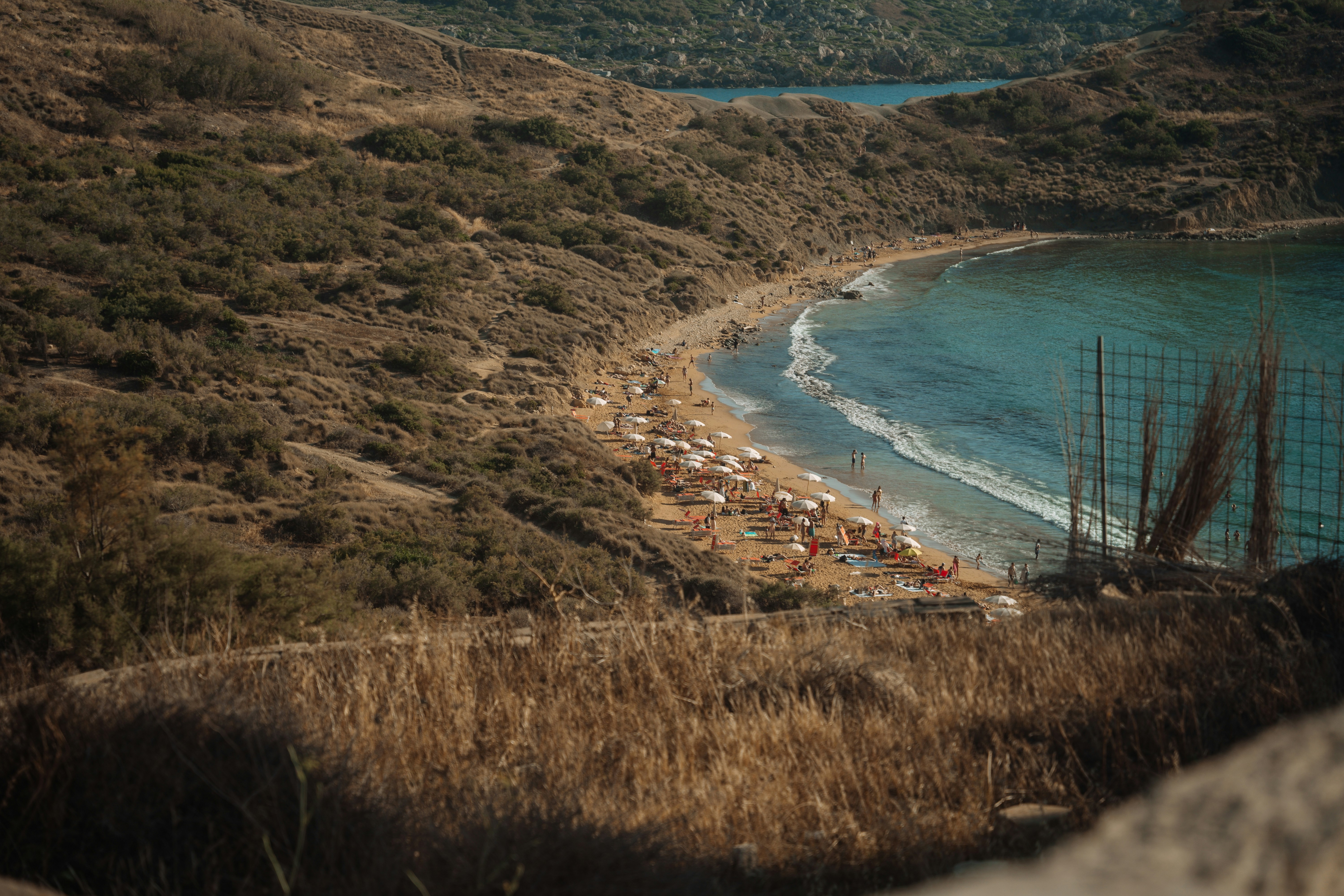 A scenic coastal landscape with a beach.