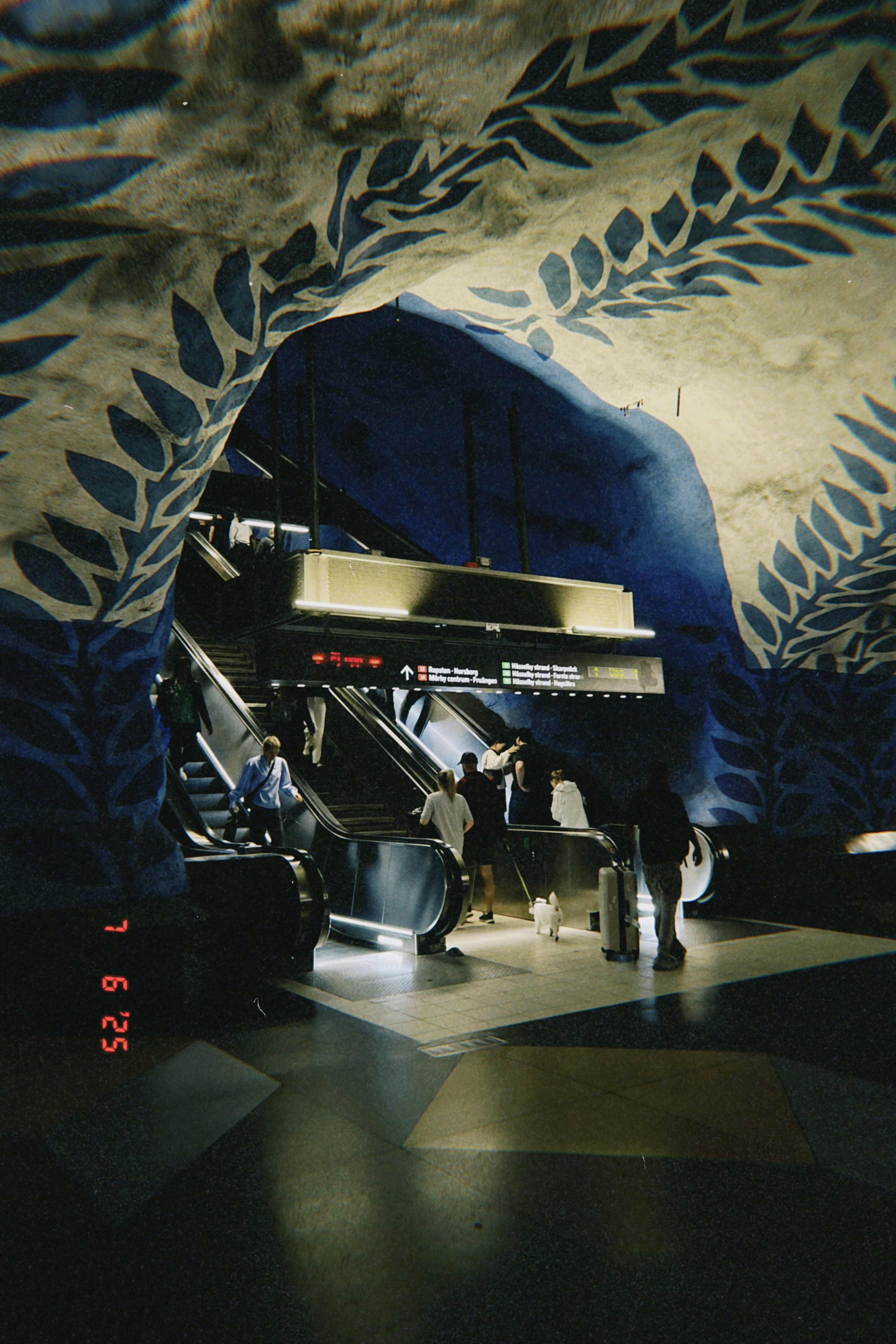A metro station with painted, blue decor.