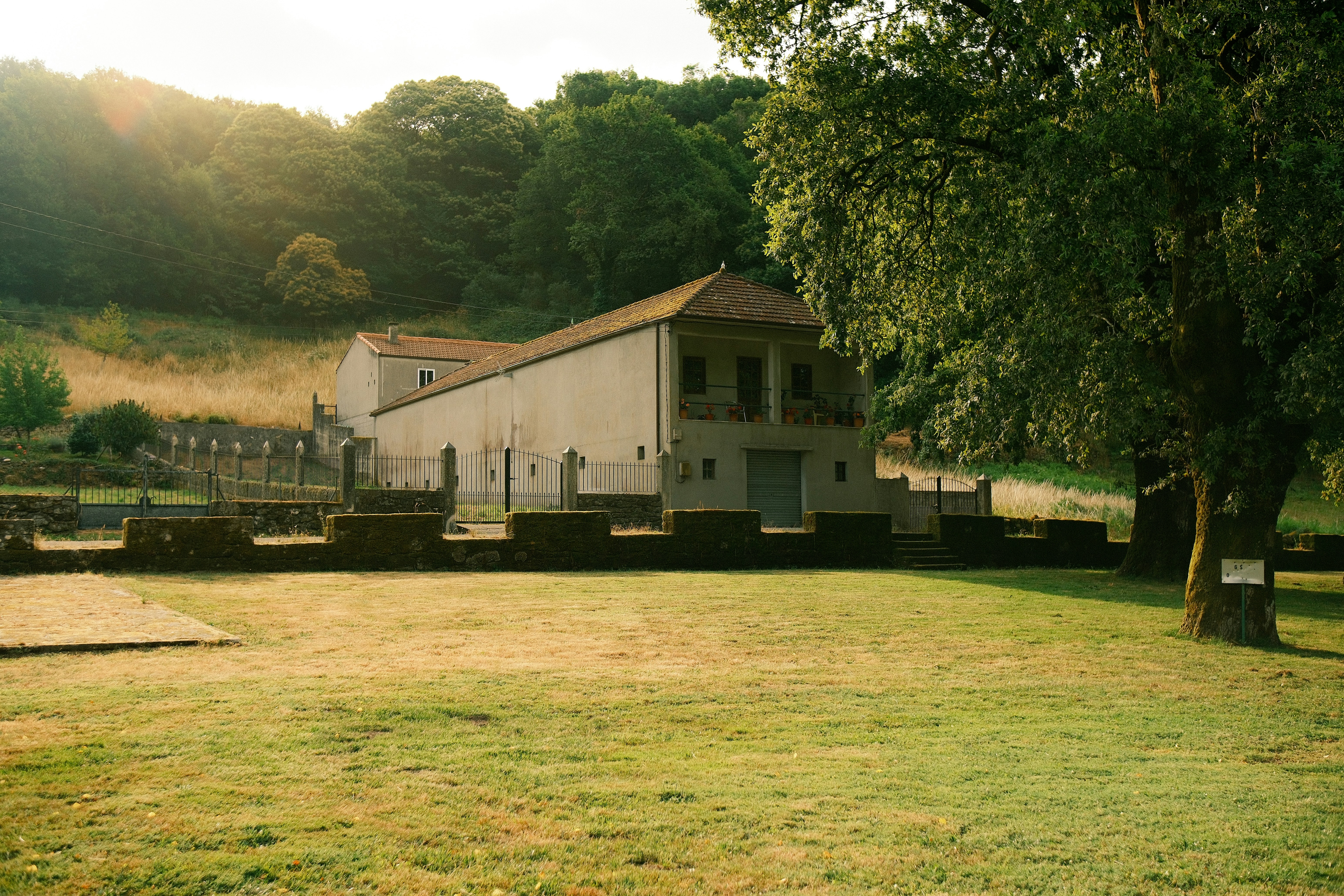 A building stands in a grassy area.