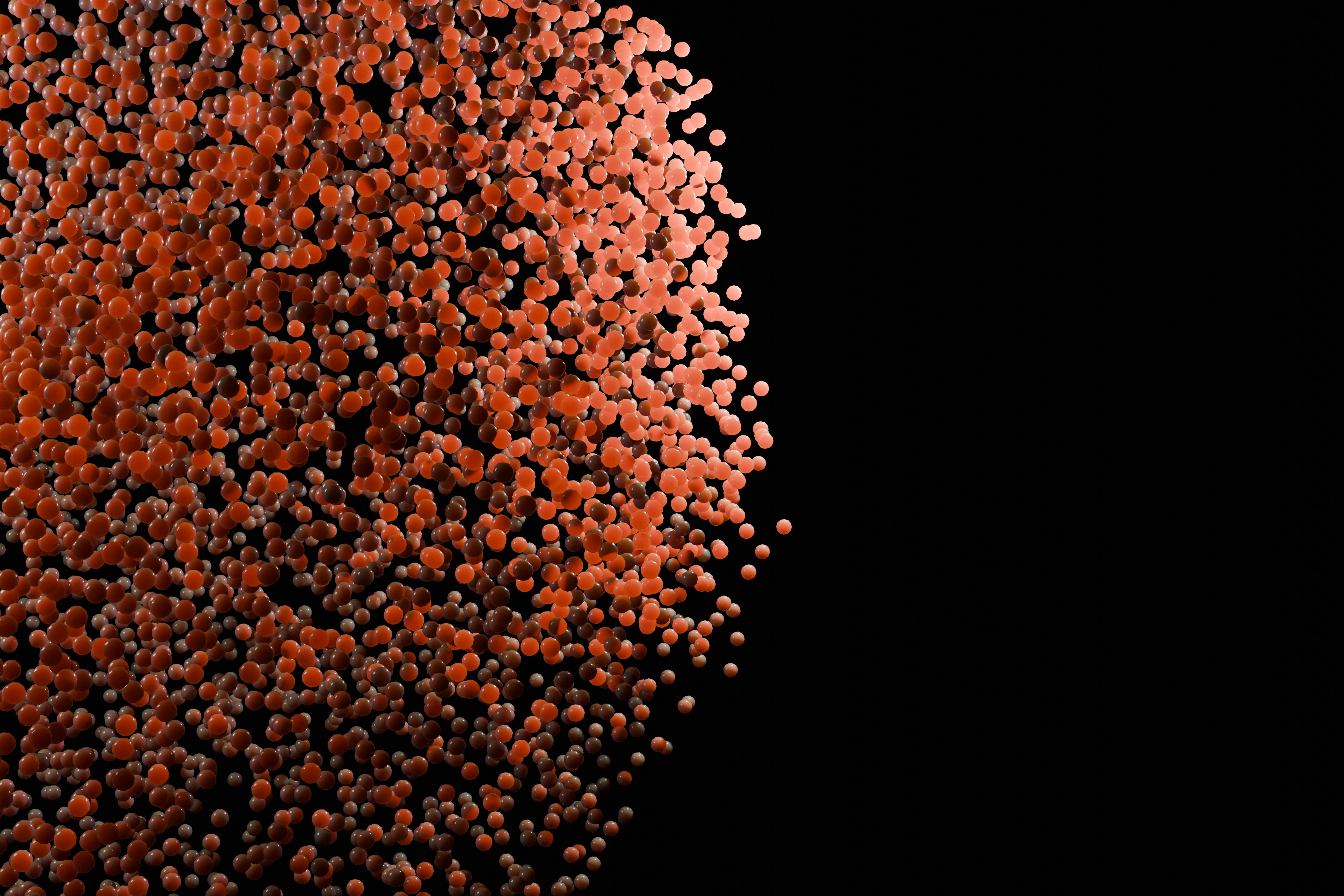 A mass of orange dots against black.