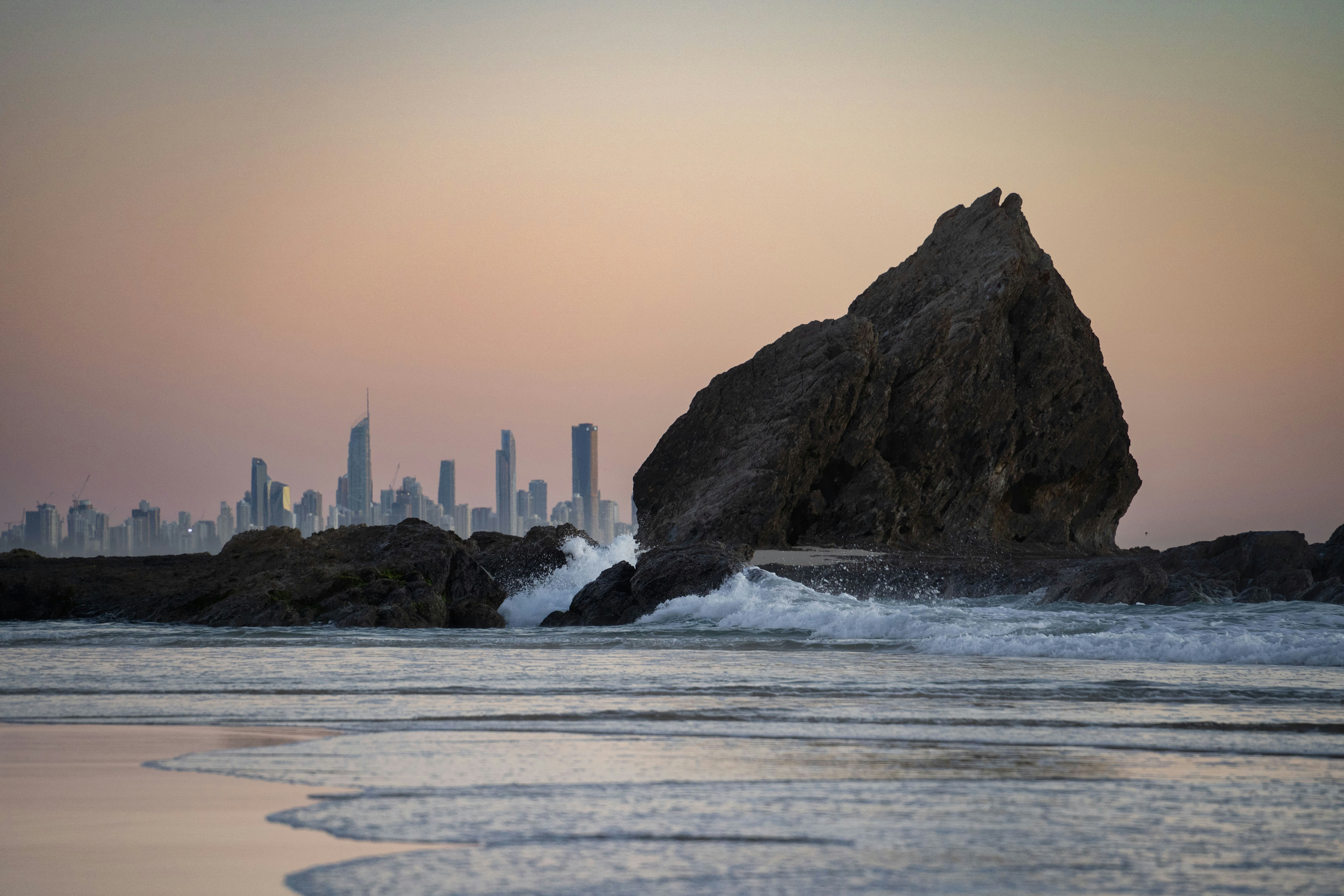 Rock formation at the beach with a skyline.