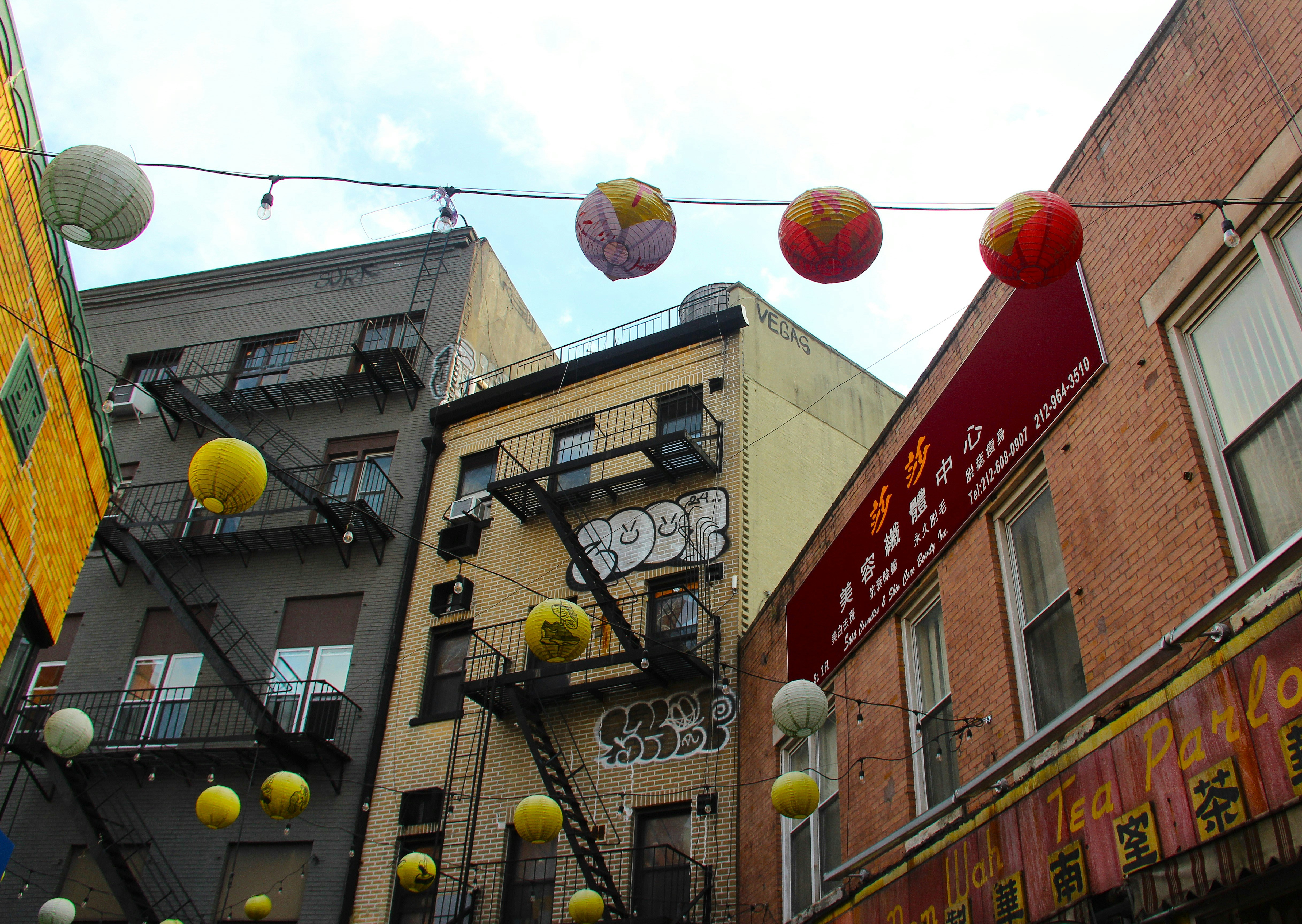 Buildings are decorated with colorful lanterns.
