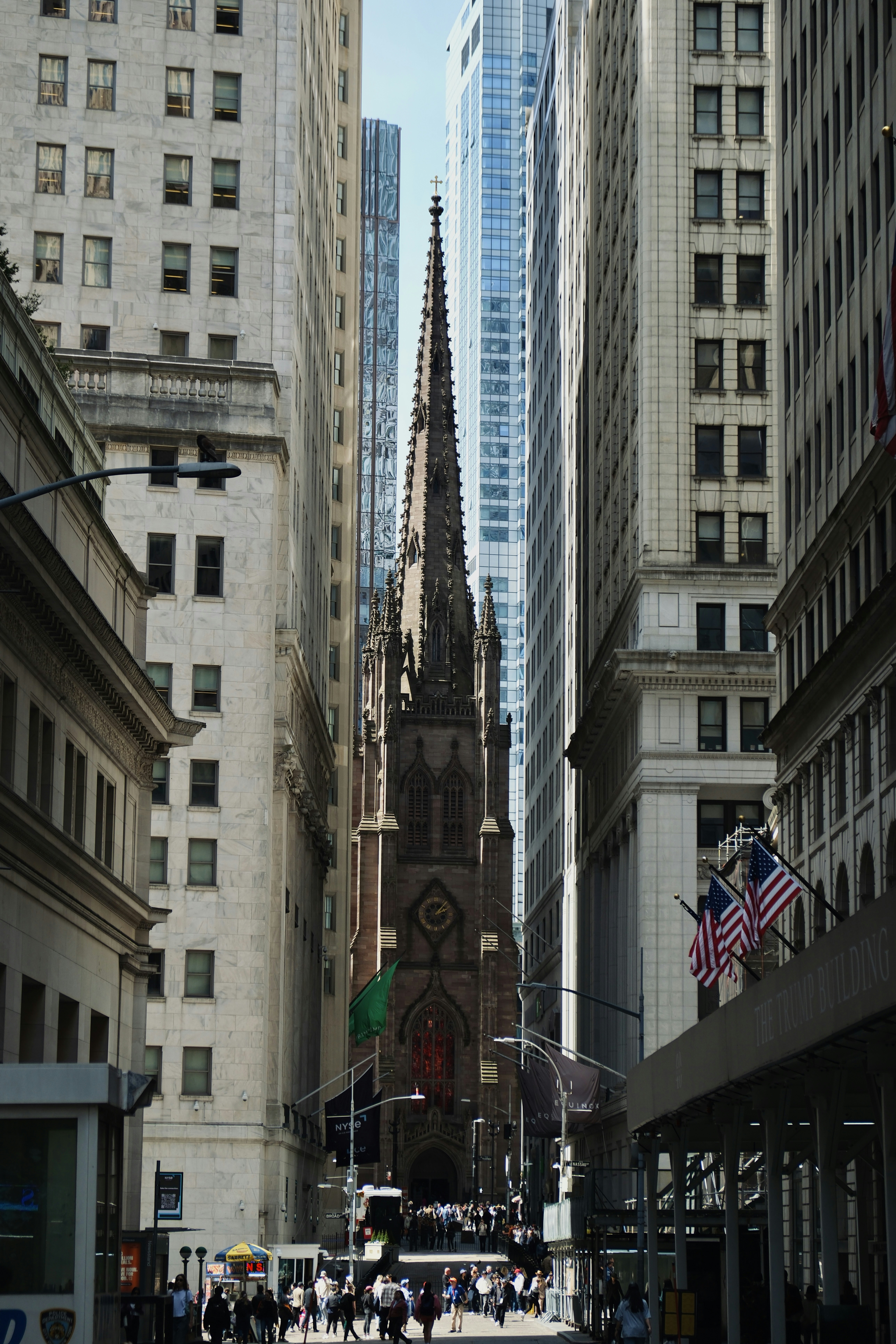 A church stands tall amidst skyscrapers.