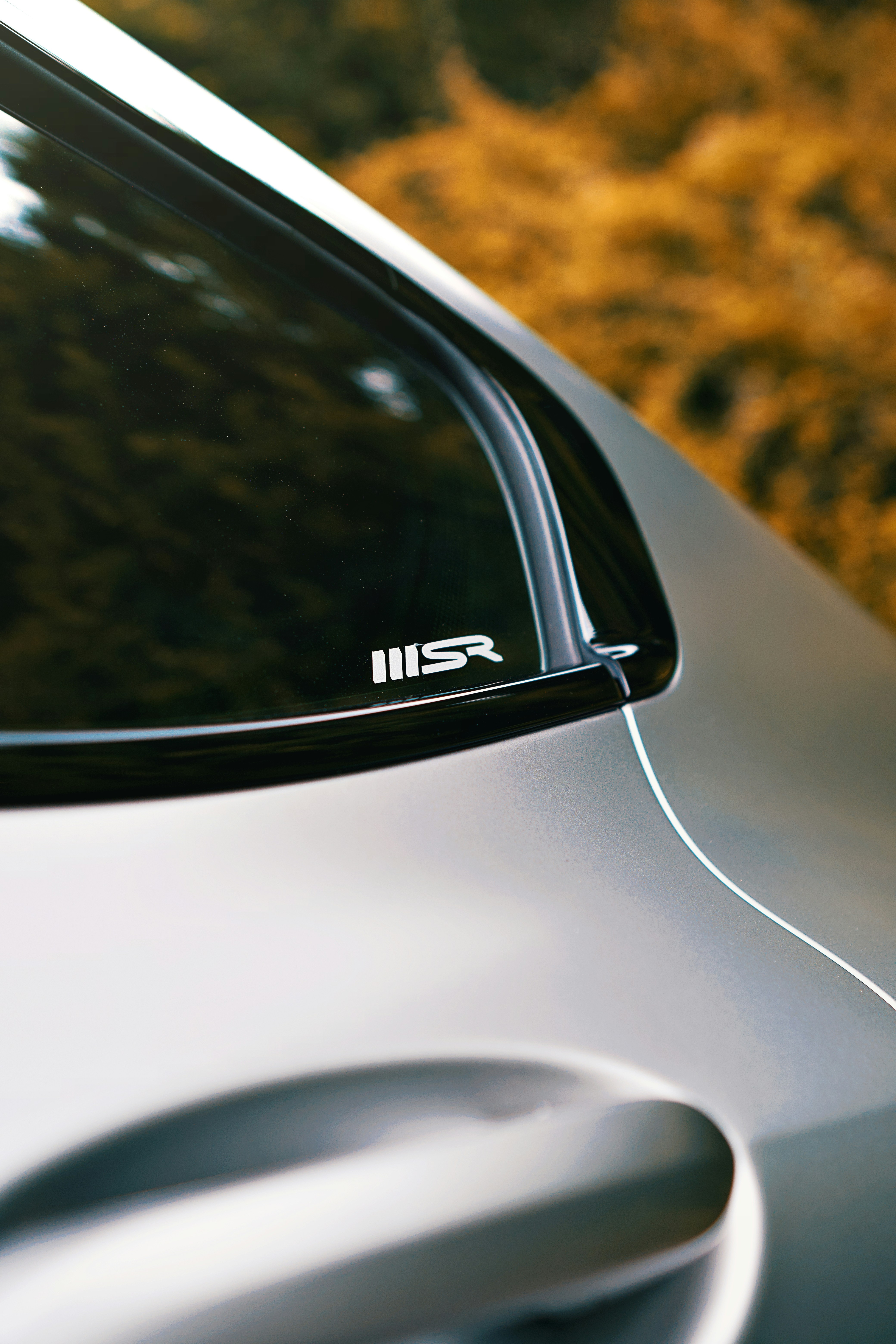 Car detail close-up with an "msr" badge.