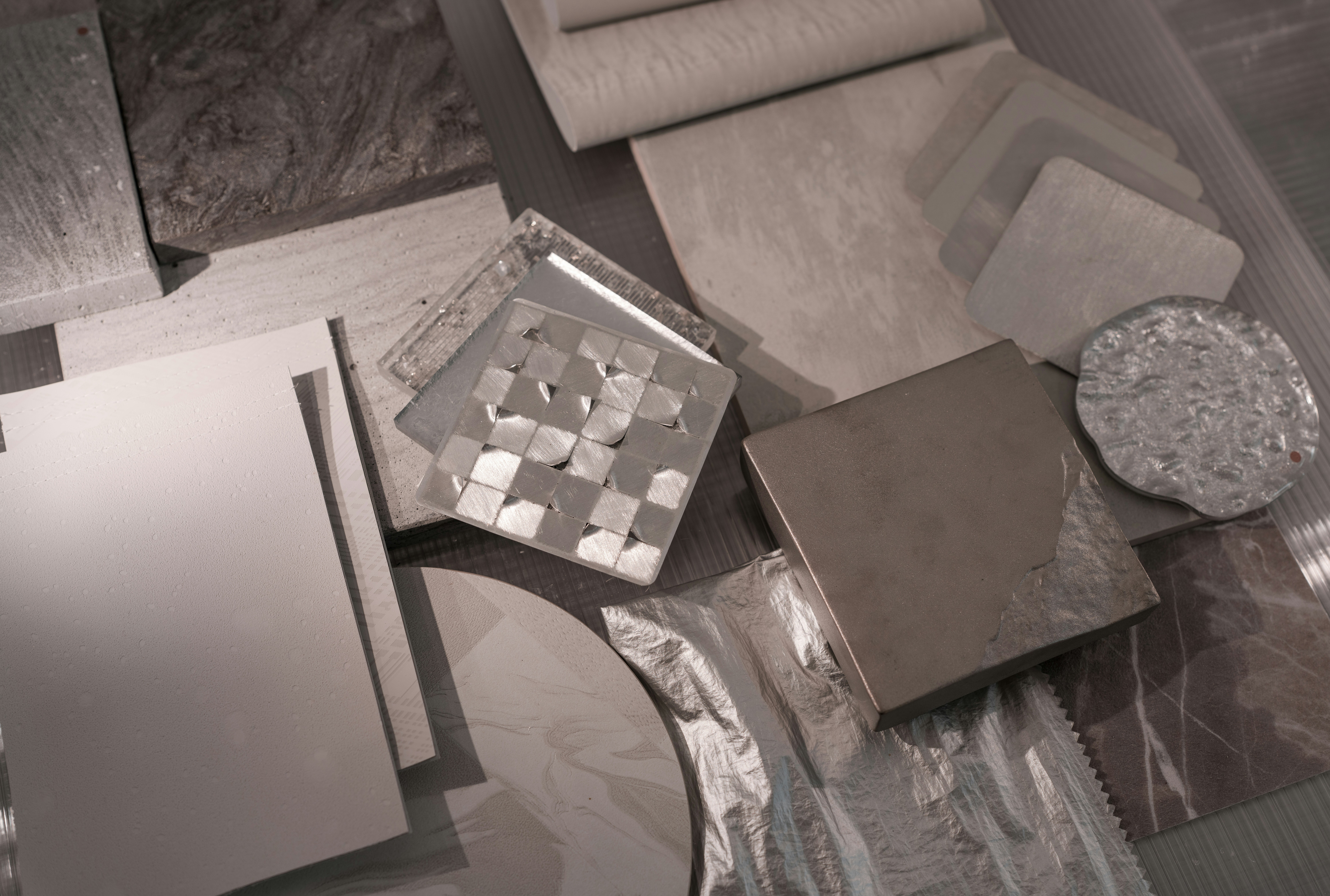 material samples like quartz countertops, hardwood flooring, and custom tiles - home gut renovation cost