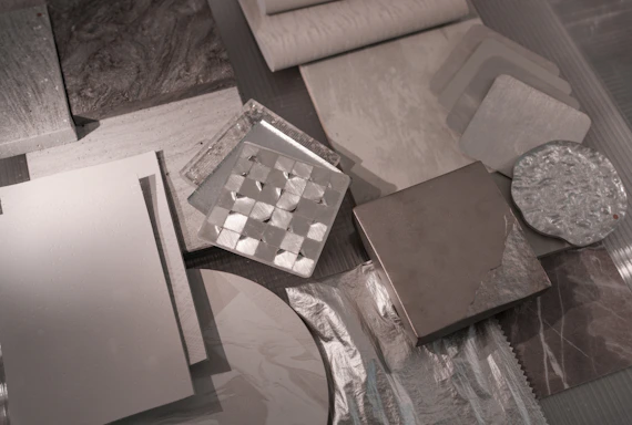 Various material samples are arranged on a surface.