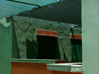 Green walls and a covered section create shadows.