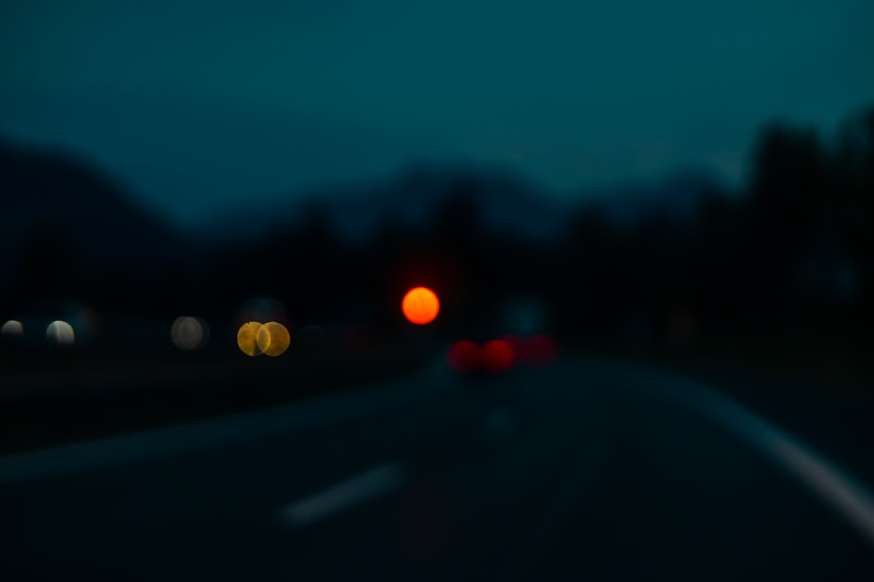 Nighttime road with blurry lights.
