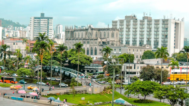 A cityscape shows buildings and trees.
