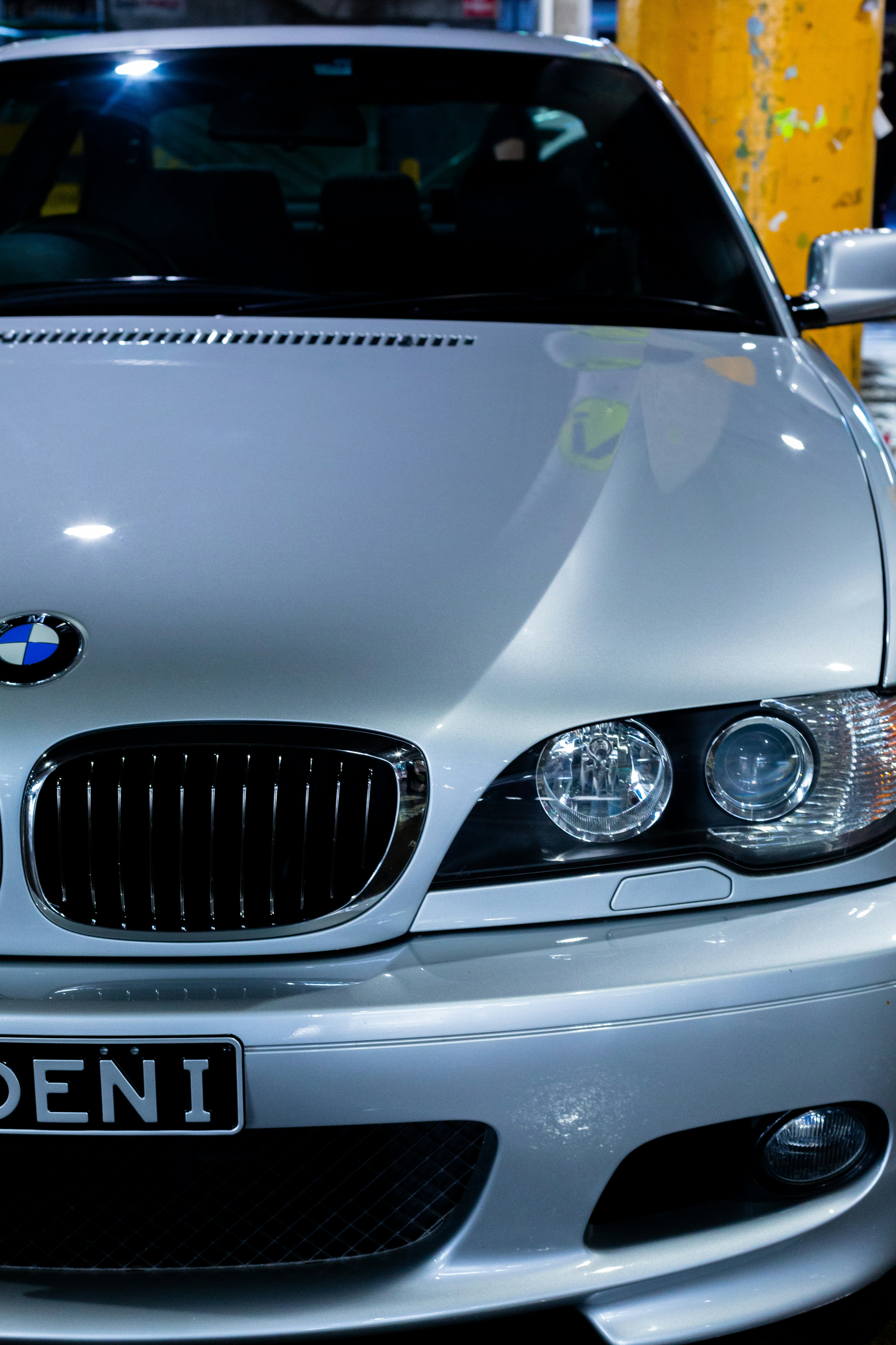A silver BMW is shown up close.