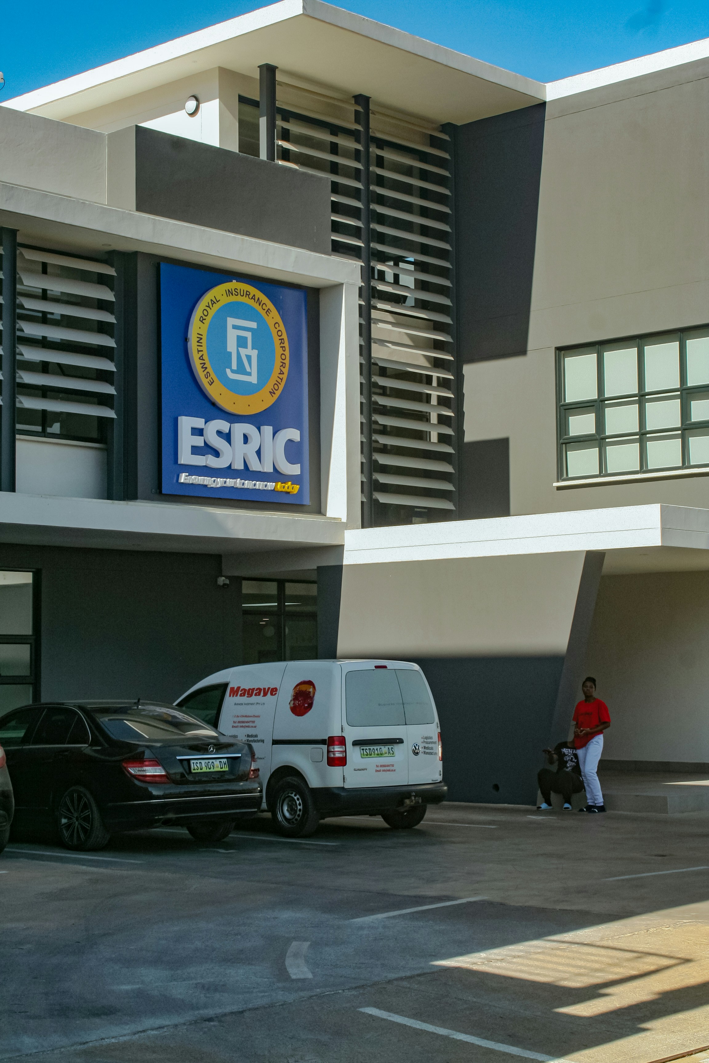 Esric building with cars parked outside.