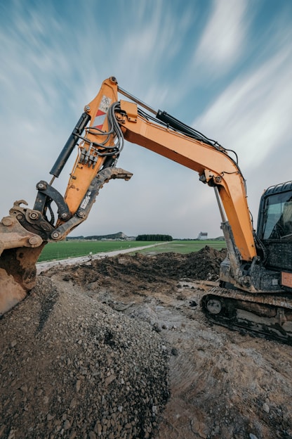 An excavator digs in a construction site.