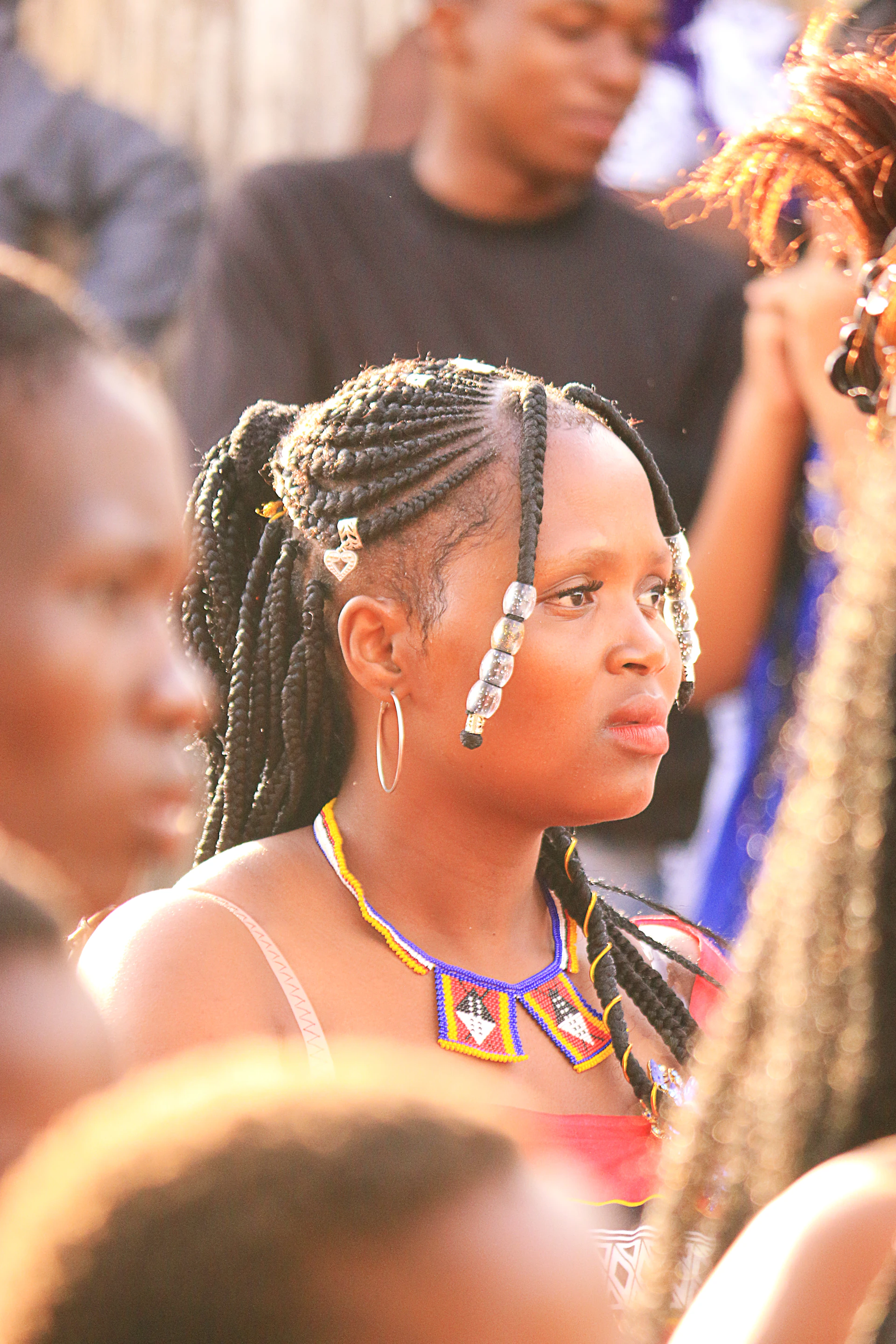 Woman in traditional attire at a gathering.