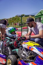 Man talking to child in go-kart