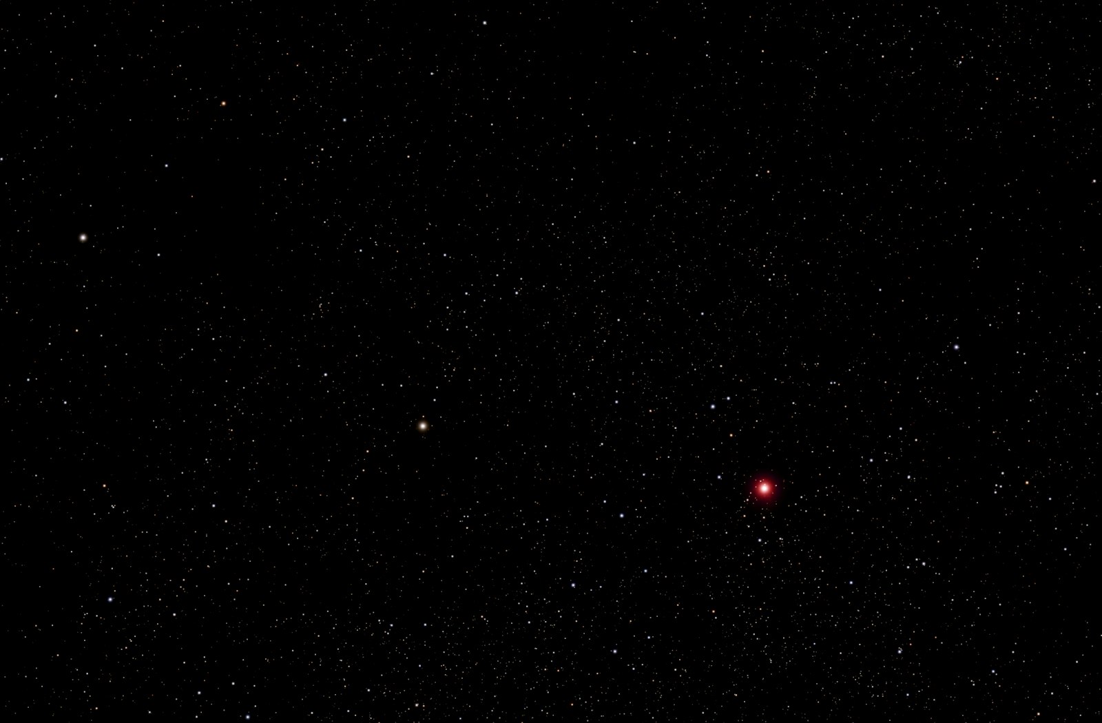 Dark expanse of space dotted with stars