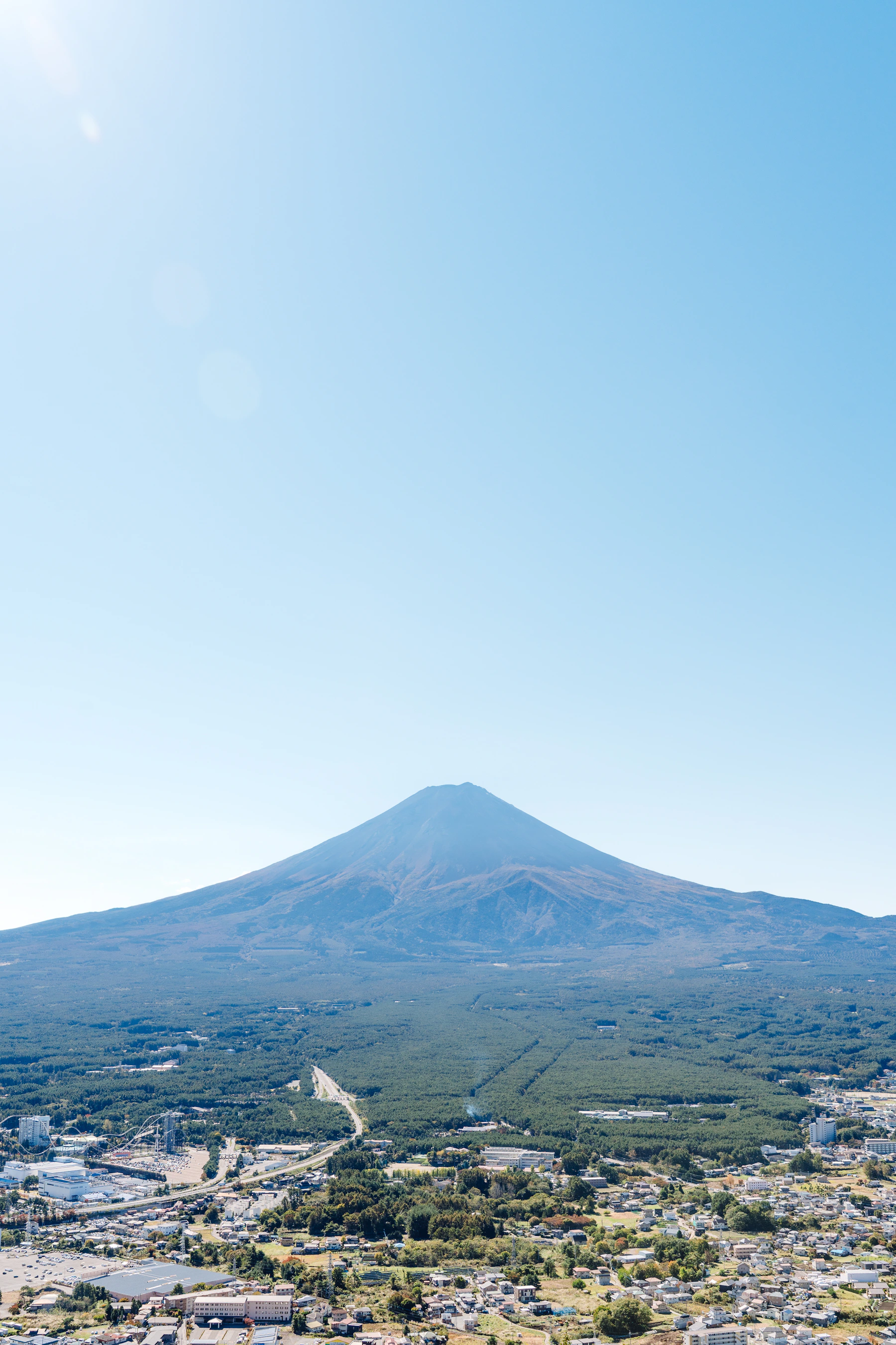 Mount Fuji rising beyond Lake Kawaguchi and a peaceful Japanese town