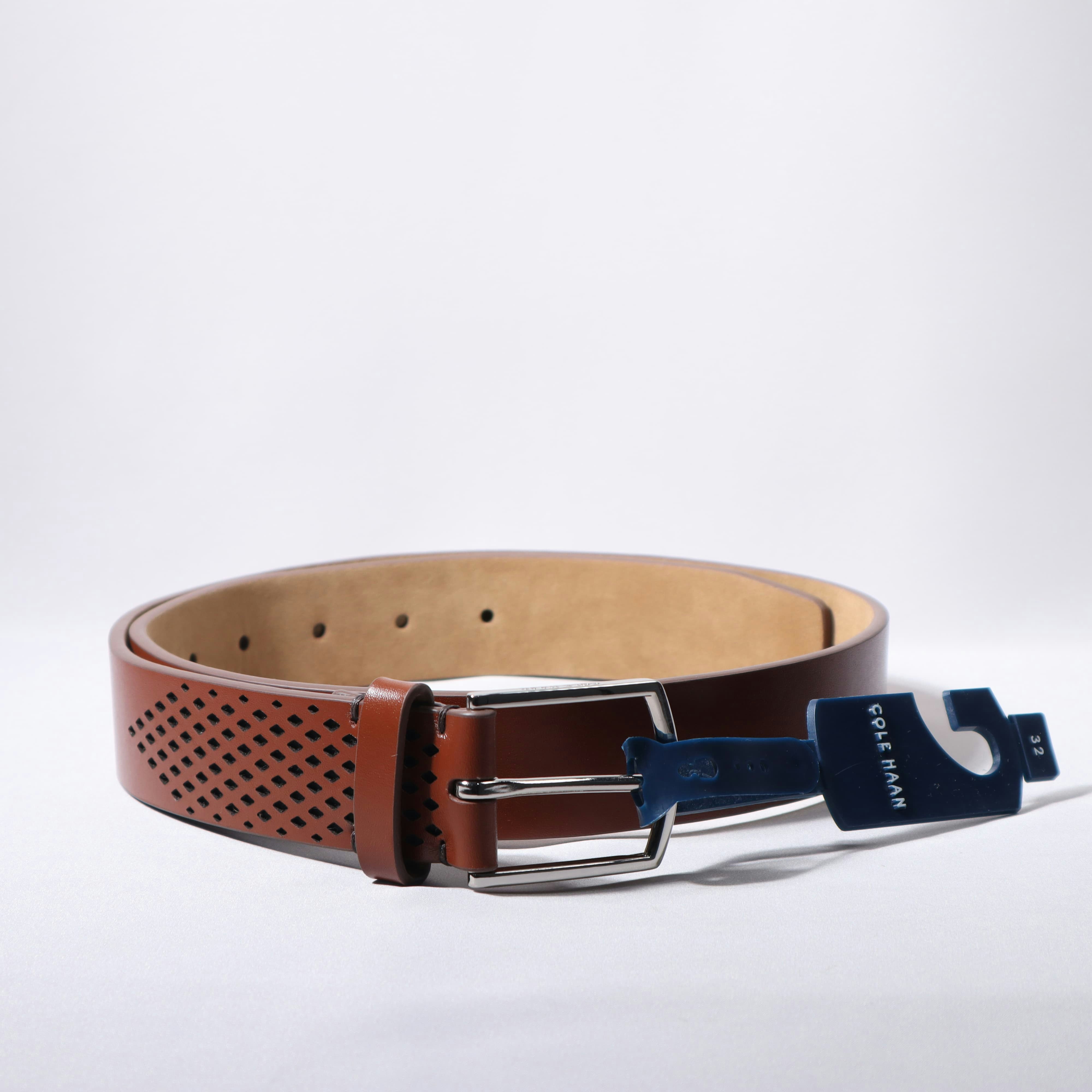 A brown leather belt is presented on a white background.