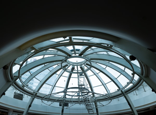 A spiral staircase viewed from below, evoking upward progress