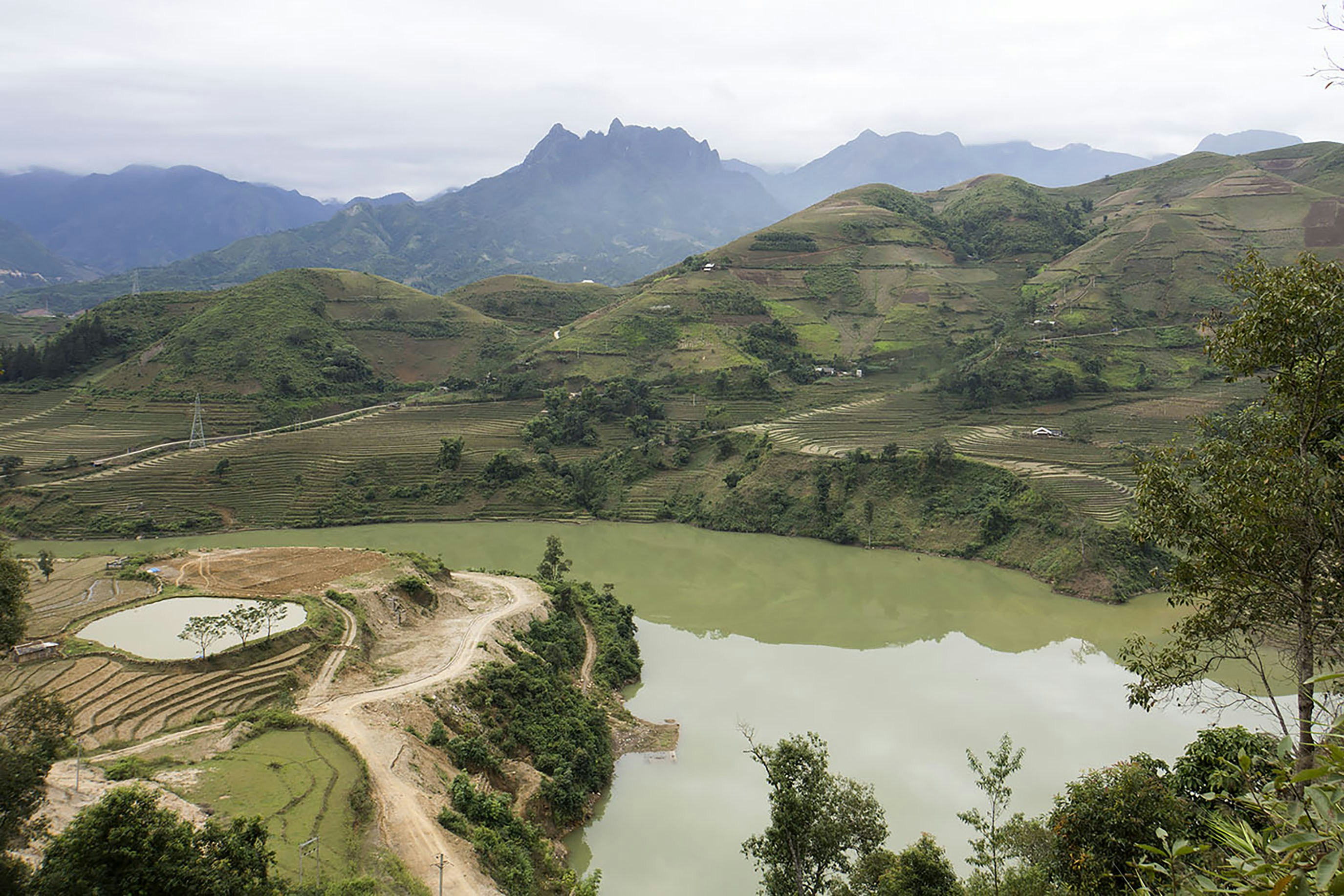 Mountains overlook a lake and surrounding terrain.